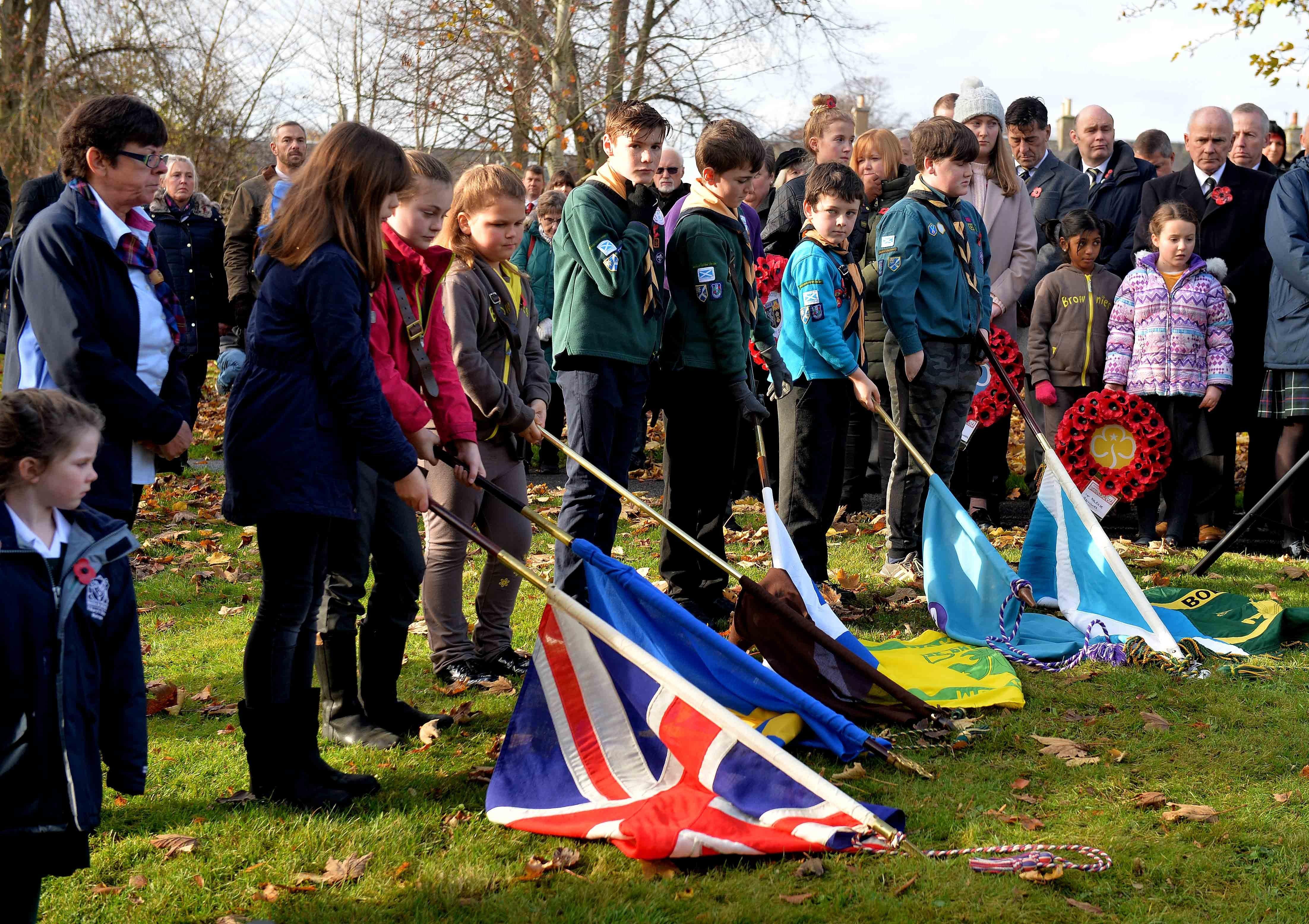 Standard bearers from the town's youth organisations take part in the act of remembrance in Melrose.