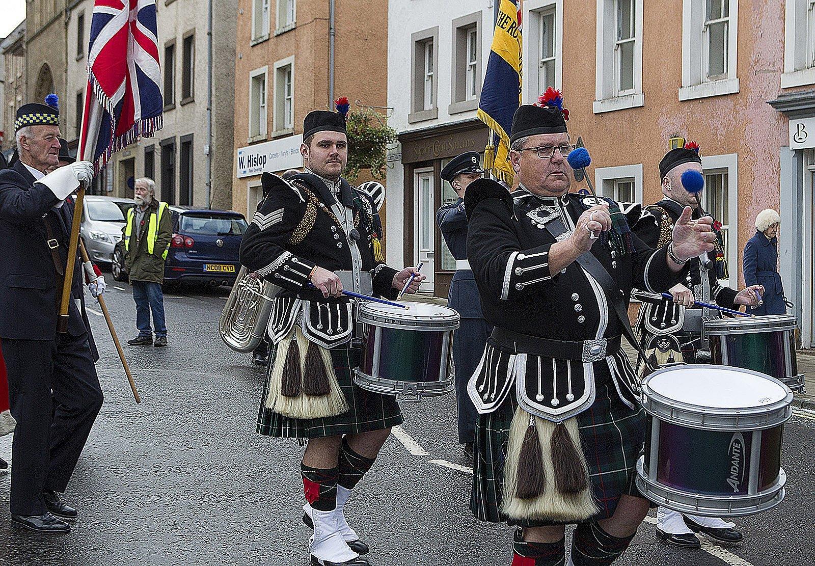 Father and son Peter and Callum Higgins from St Boswells, play in the pipe band during Jedburgh's remembrance Sunday parade.