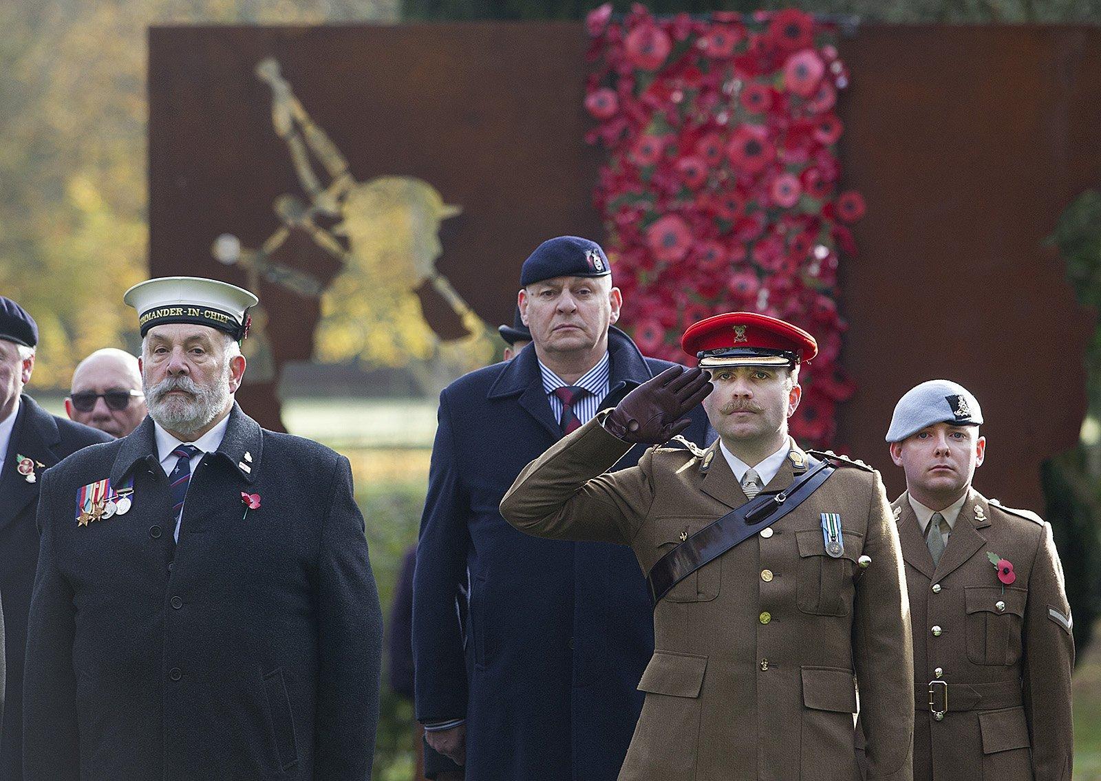Captain Alex Bakovljev salutes at the remembrance service in Hawick.