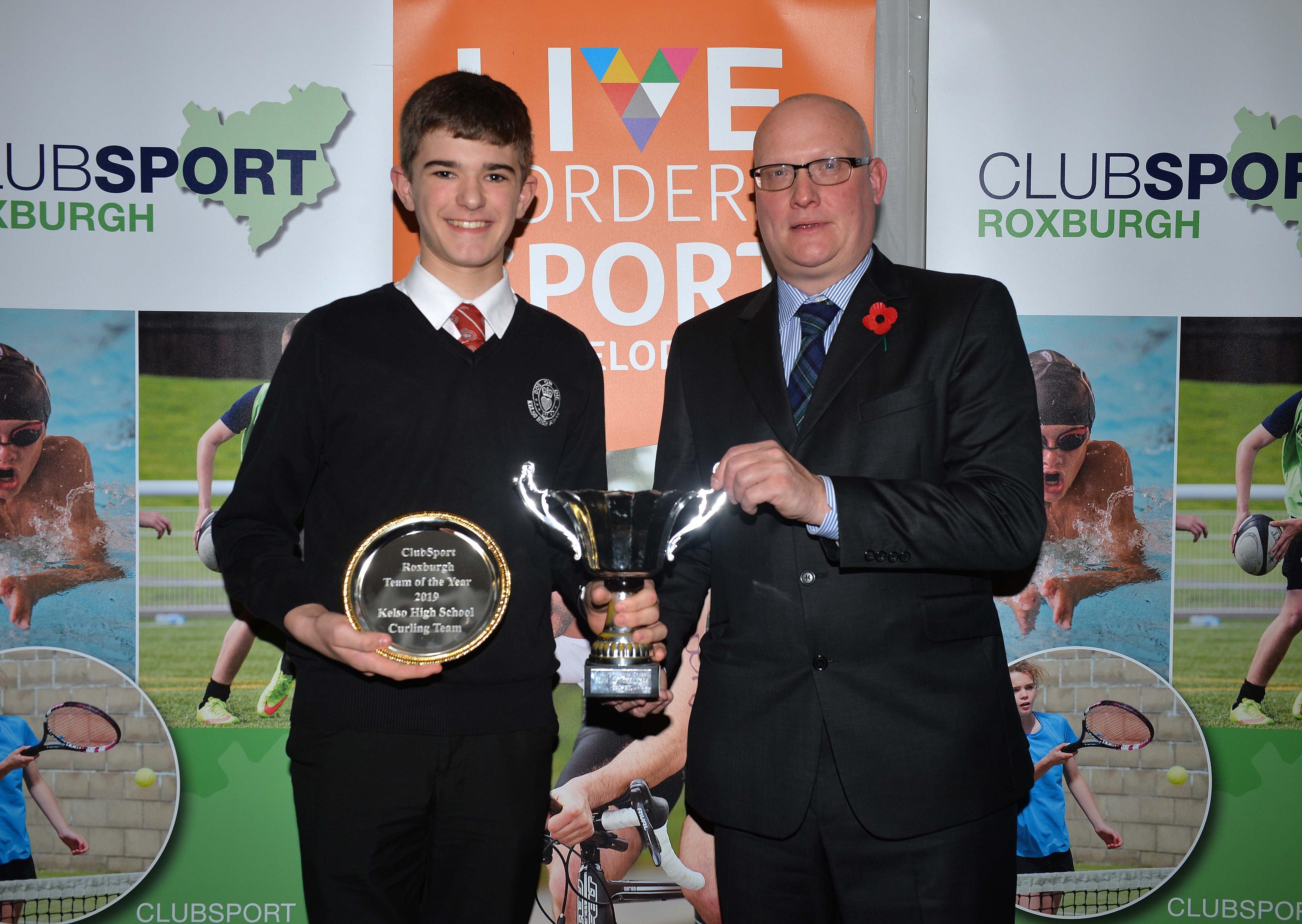 Callum Mclean, left, accepted the Team of the Year prize on behalf of Kelso High School's curling rink.