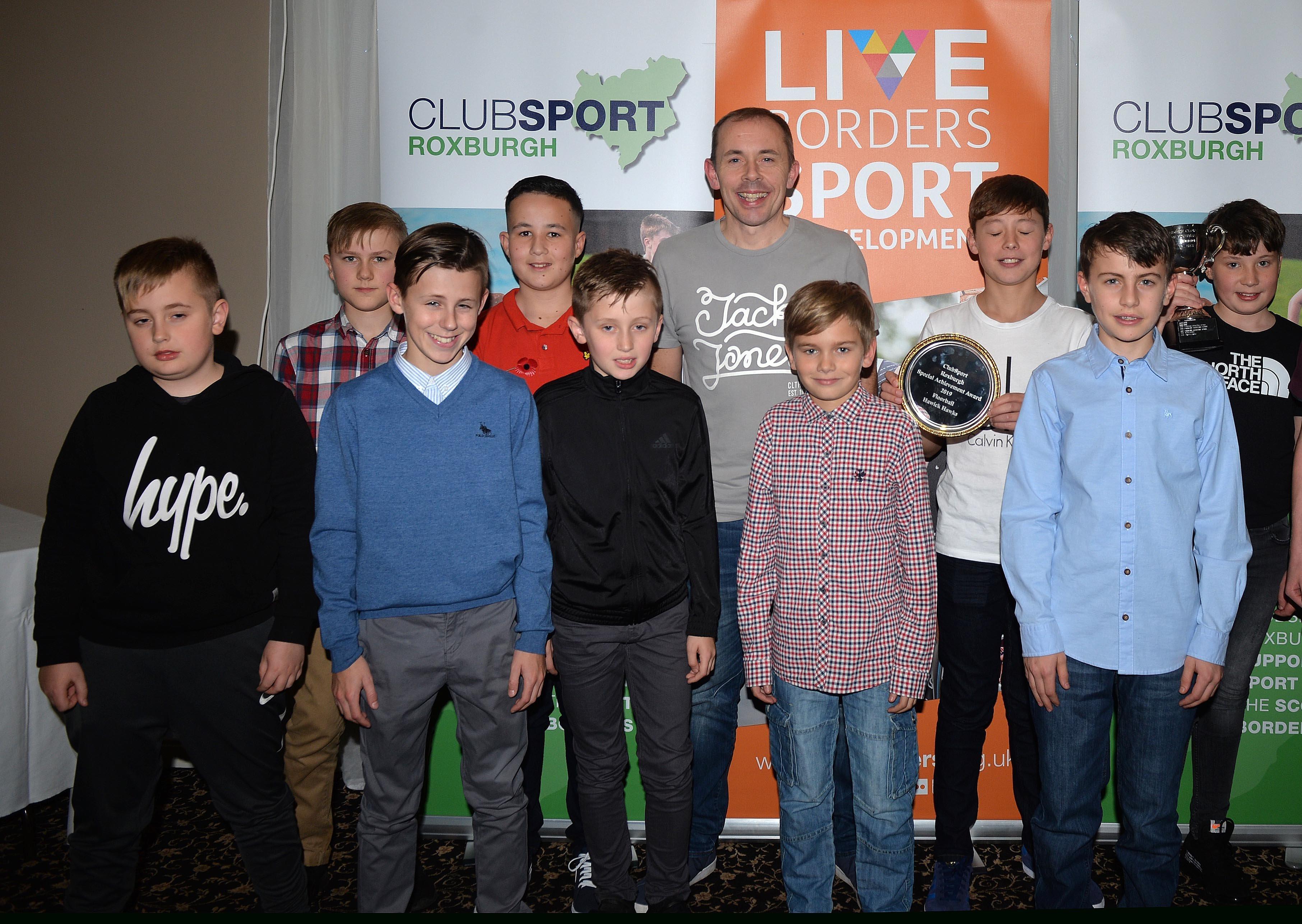 Coach of the Year, Craig Girvan, with players from the Hawick Hawks floorball team.