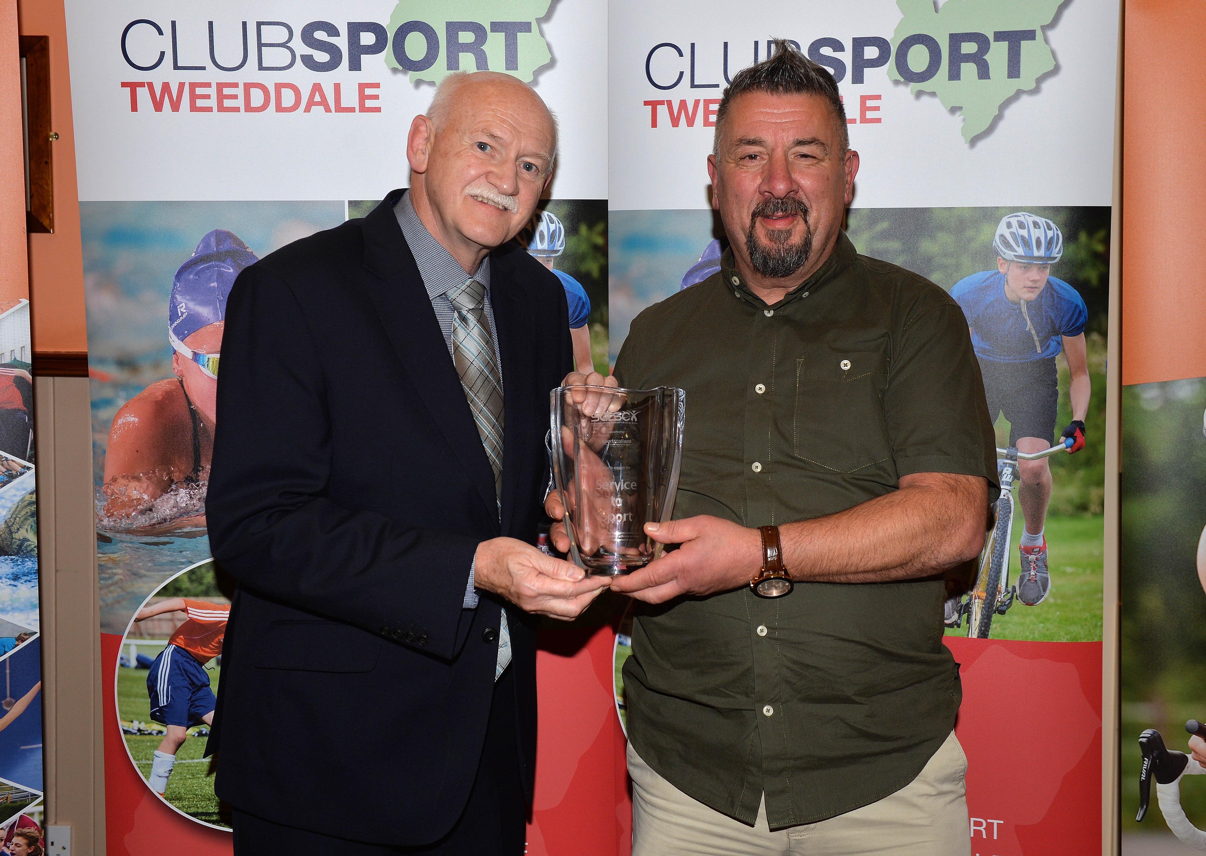 Rick Kenny presents Gerry Rossi with his Service to Sport Award. Tweeddale Clubsport awards (picture: Alwyn Johnston)