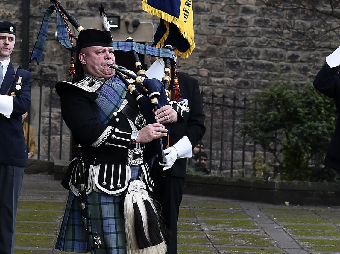 A piper from the Royal Brtish Legion played as mourners entered the Cathedral.