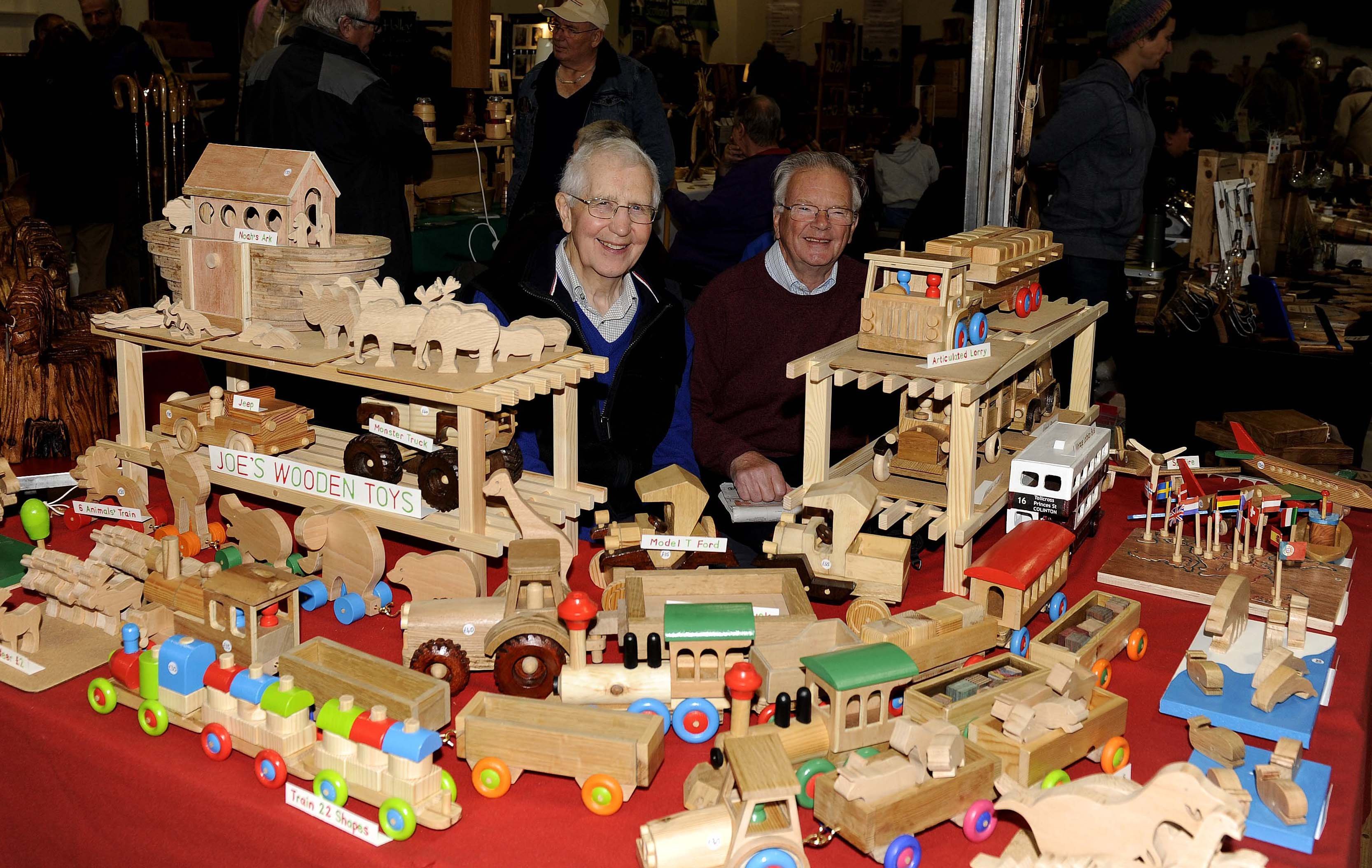 On Joe's wooden toys stall is Stanley Cartmell and Chris Beaumont (Joe was Stanleys dad)  at the Tweed Valley Forest Festival in Peebles.