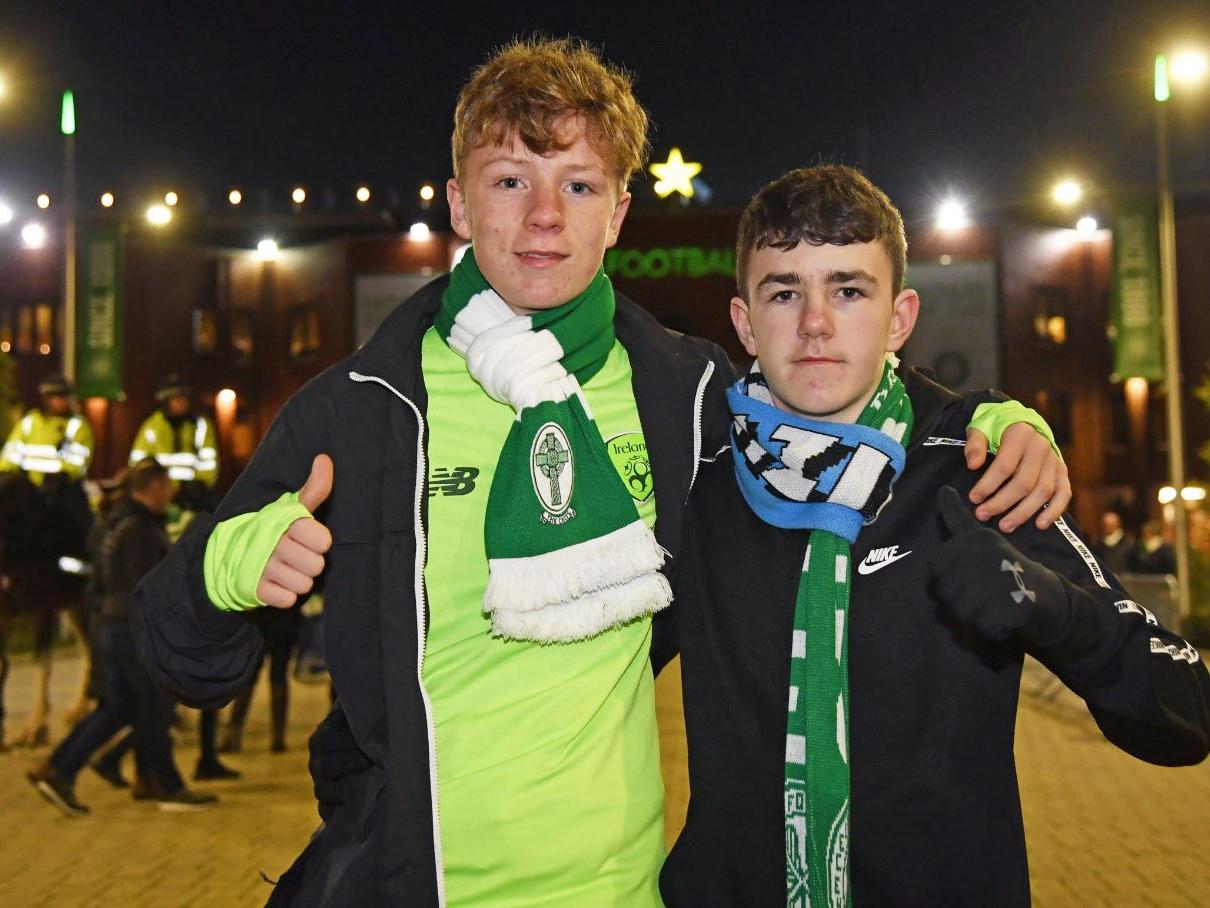 Two supporters show their colours ahead of the Group E showdown