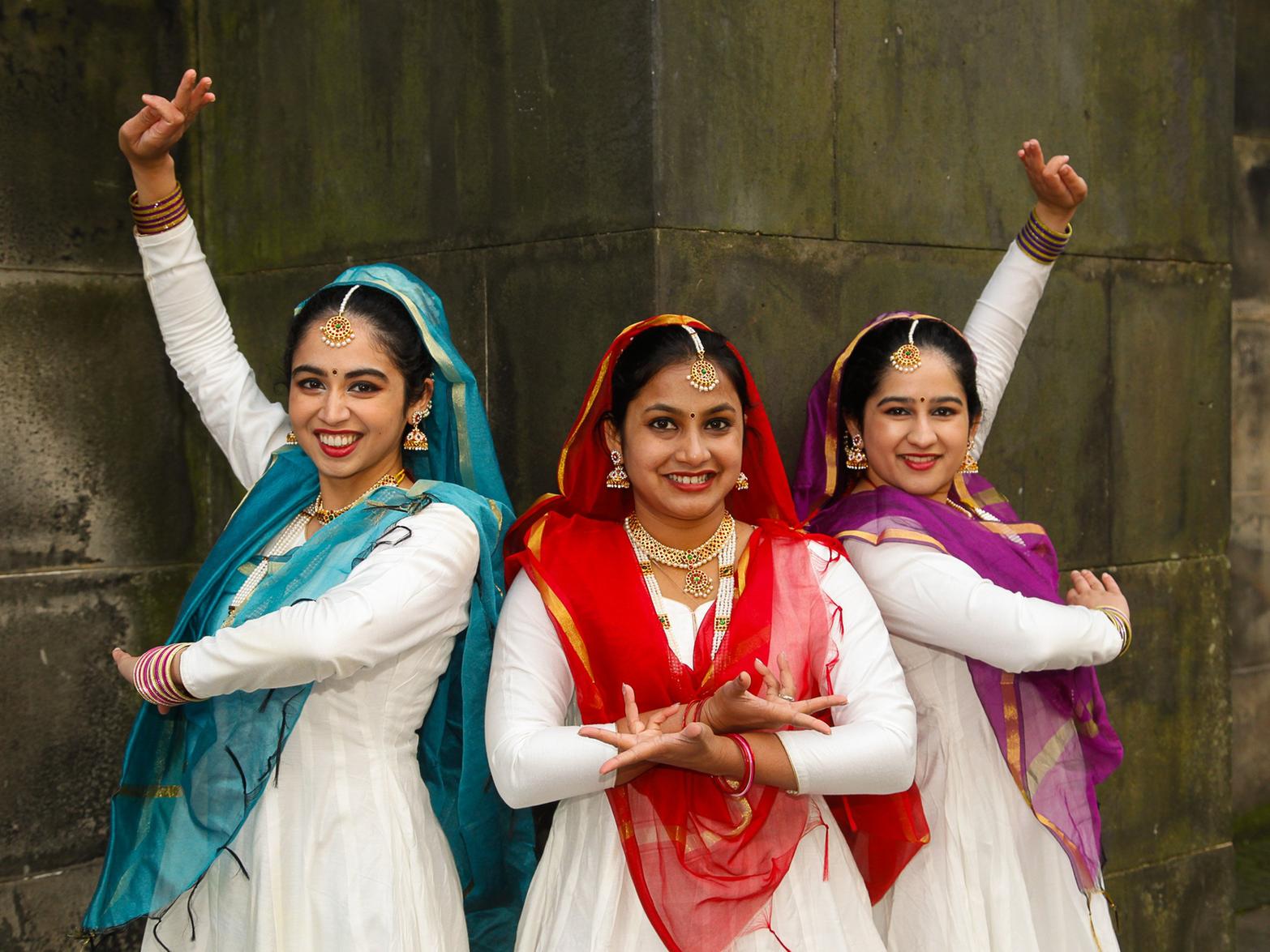 Tanvi, Sushrima and Richa  of the Ashram Dance Group took part in Saturday's parade. Picture: Scott Louden