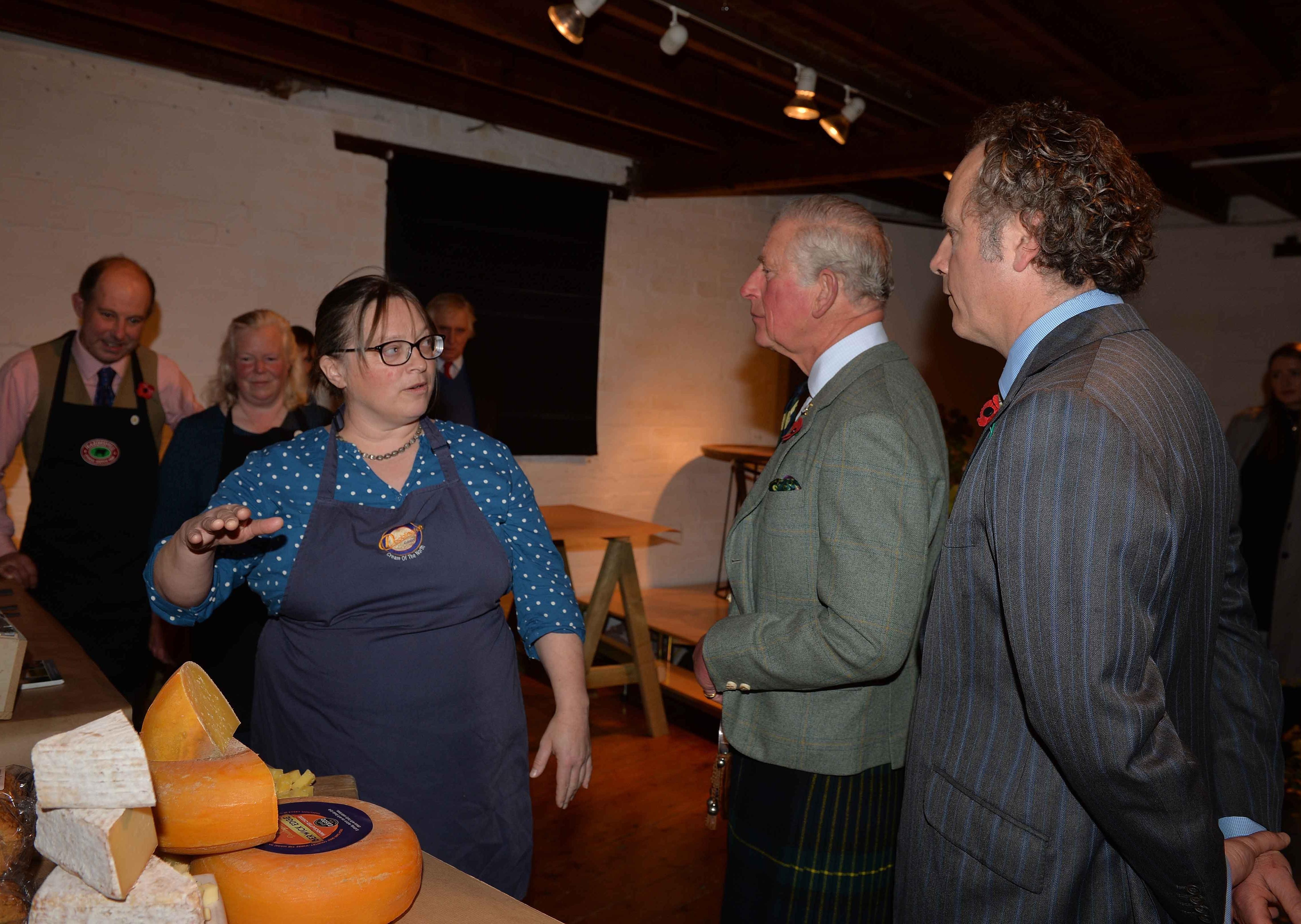 Maggie Maxwell from Doddington's Dairy talks with the Duke of Rothesay at Mainstreet Trading.