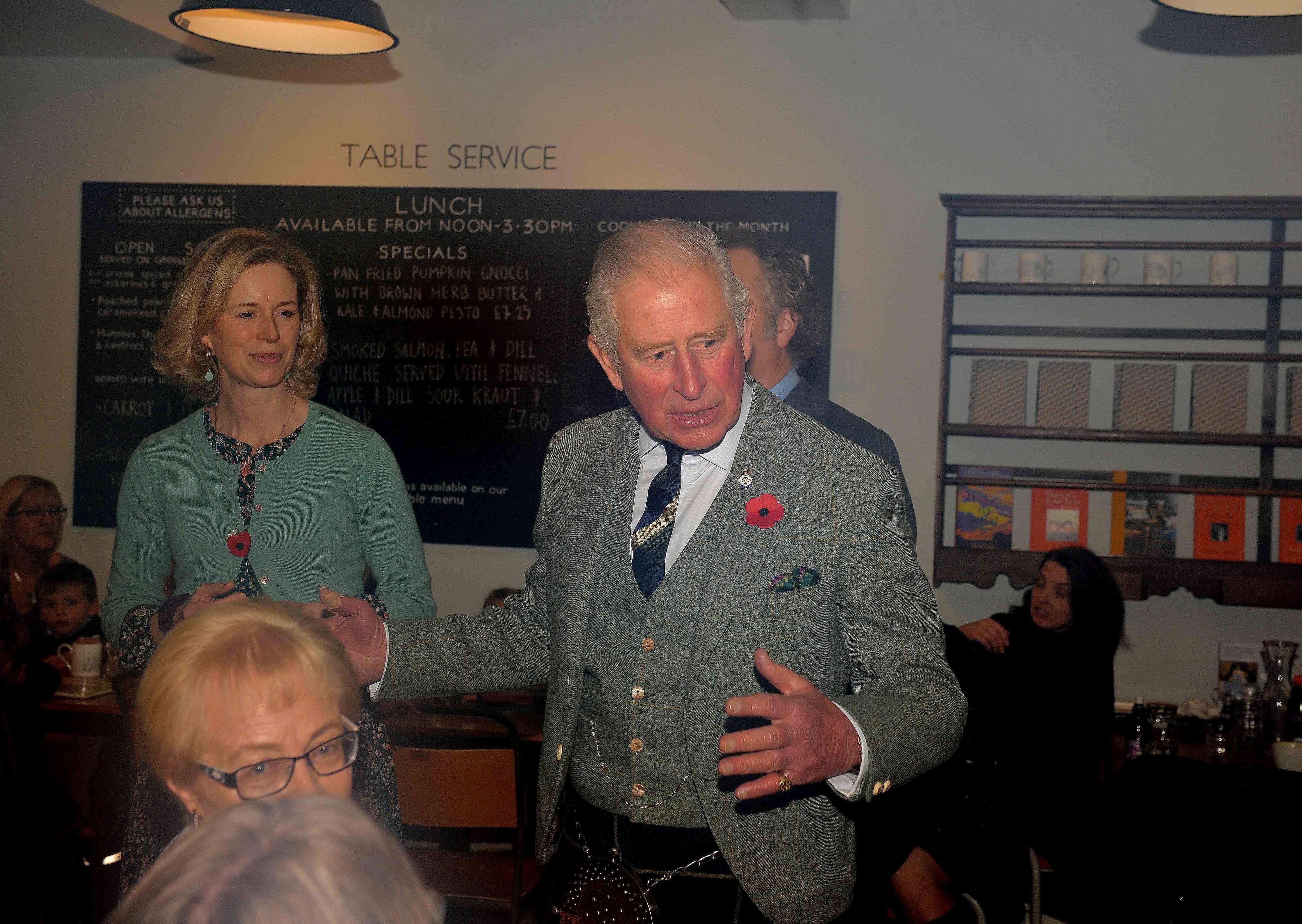 Duke of Rothesay speaks with diners in the cafe.
