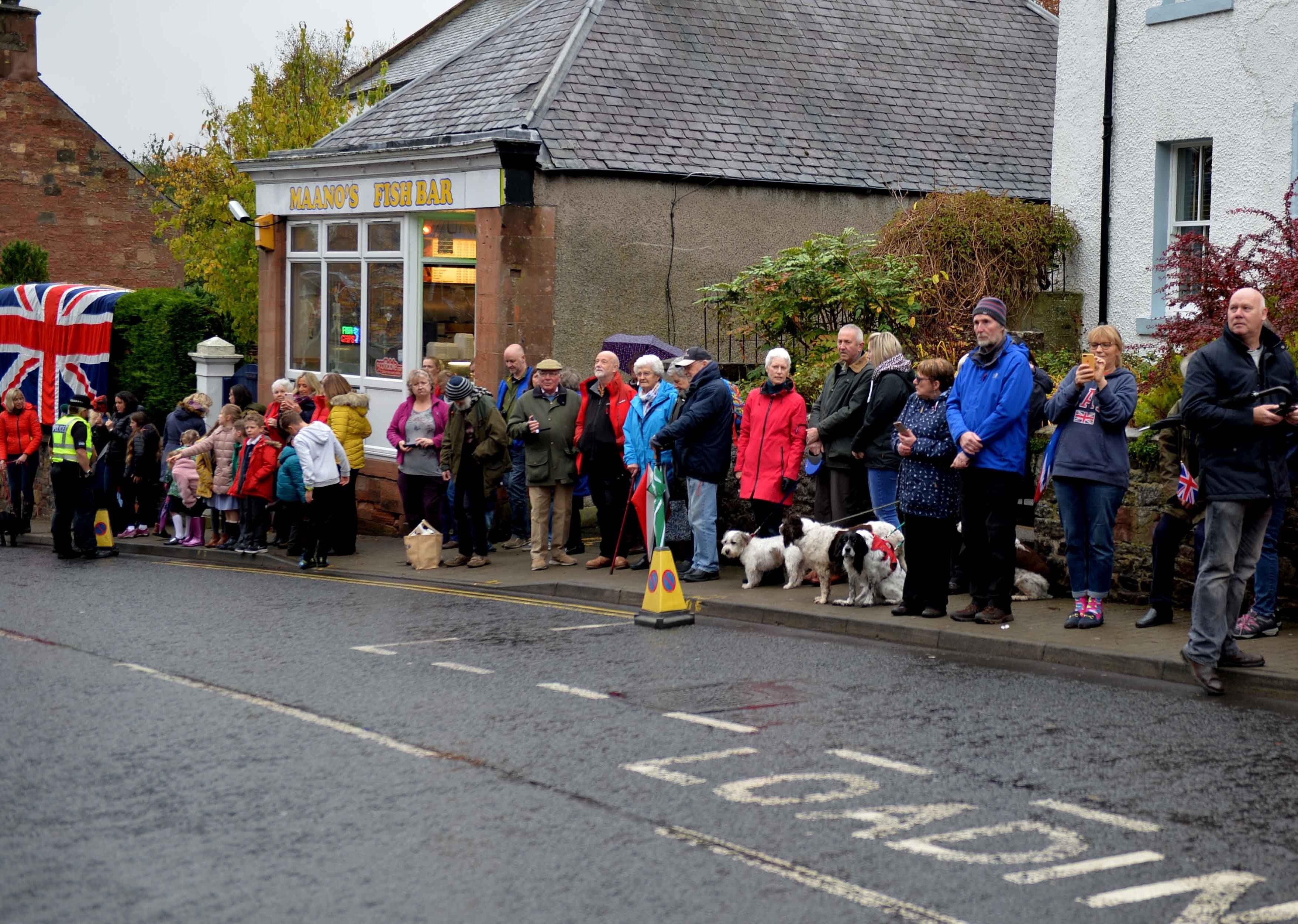 Crowds line Main Street in St Boswells to welcome the royal visitor.