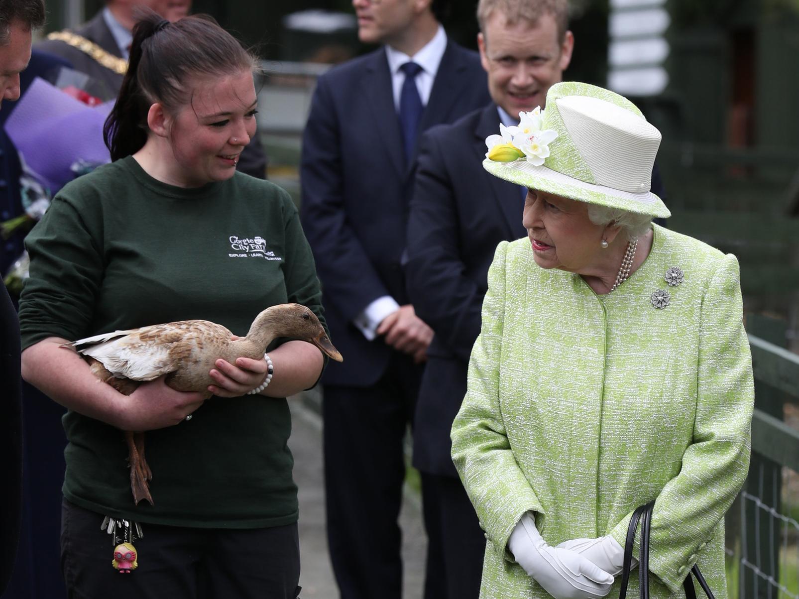 The Queen visits Gorgie Farm and meets a 'michevious' duck.