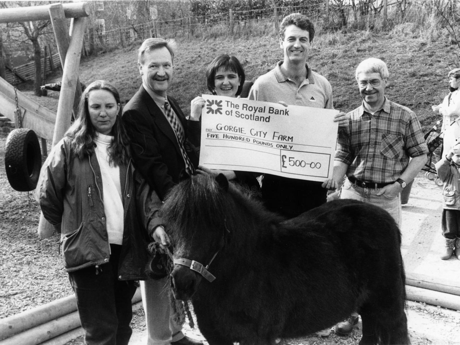 A cheque for 500 is presented at Gorgie City Farm.