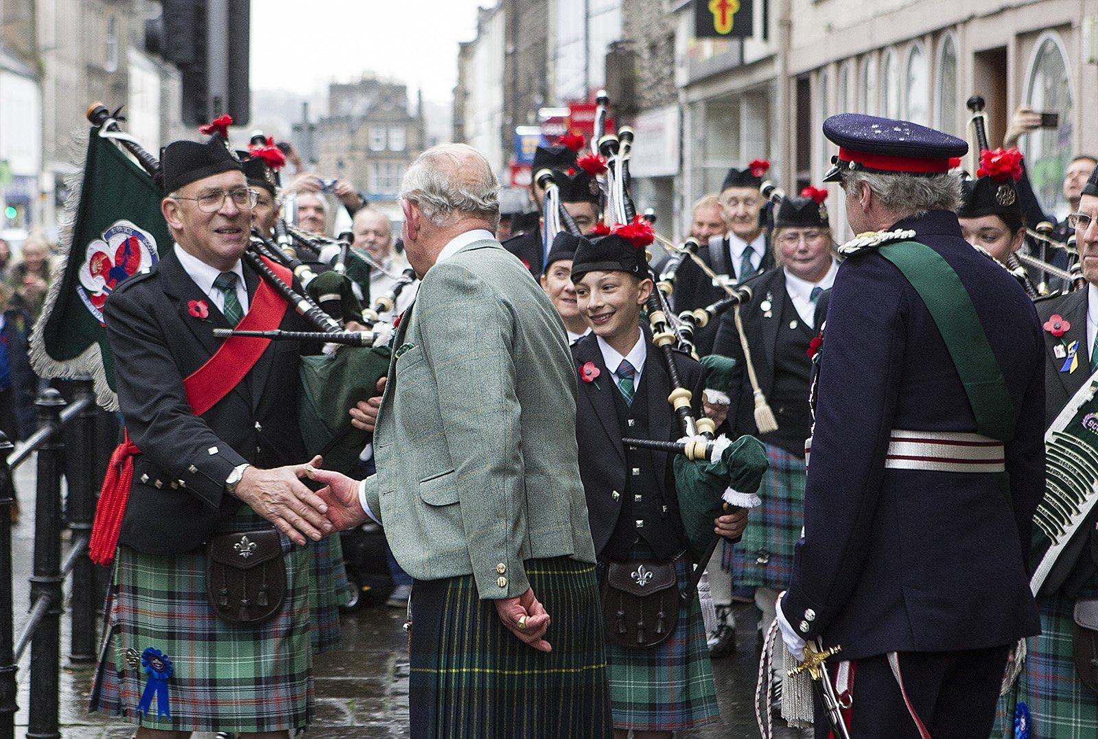 Hawick Scouts Pipe Band pipe major Michael Bruce meets the Duke of Rothesay.