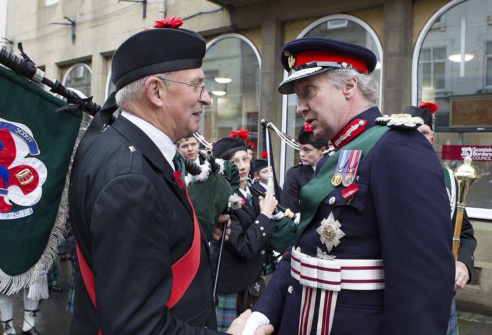 Hawick Scouts Pipe Band pipe major Michael Bruce meets the Duke of Buccleuch.