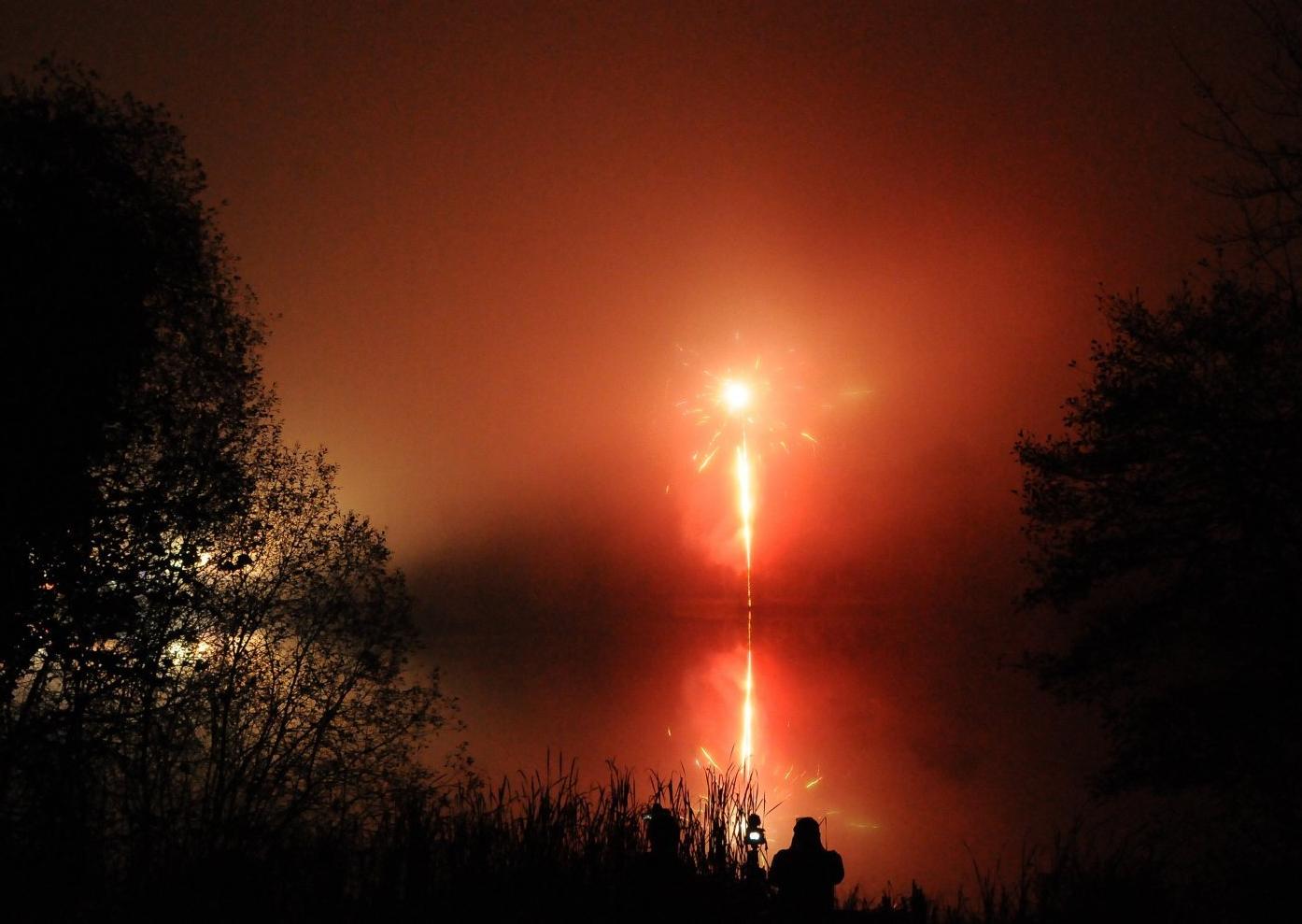 Fireworks on a misty loch.