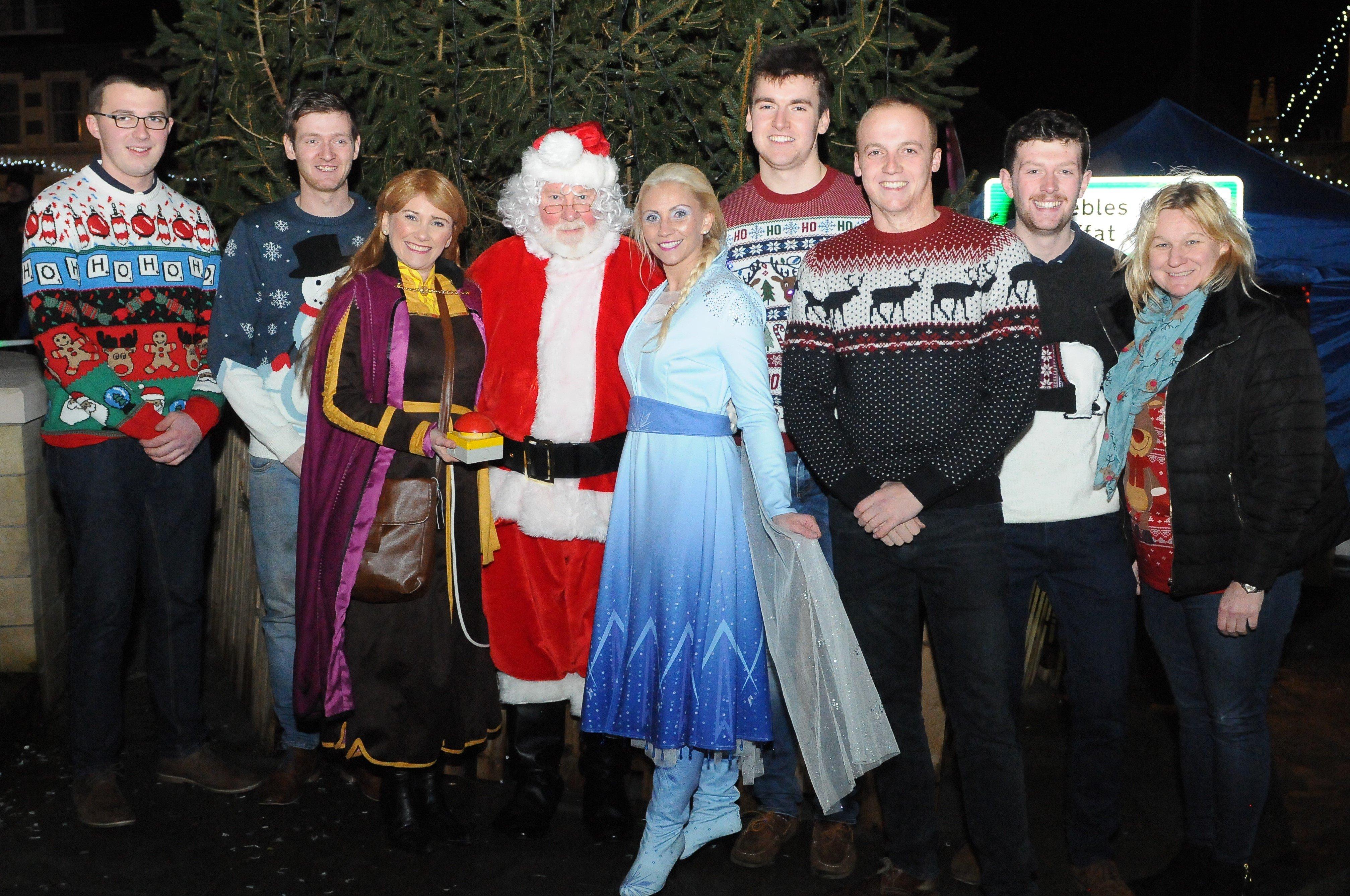 Attendant Conall Fairbain,2019 standard bearer Craig Monks, Anna from Frozen, Santa, Elsa from Frozen, attendants Andrew McColm, Adam Nichol and Liam Cassidy along with organiser Caroline Pennman at the switch-on.