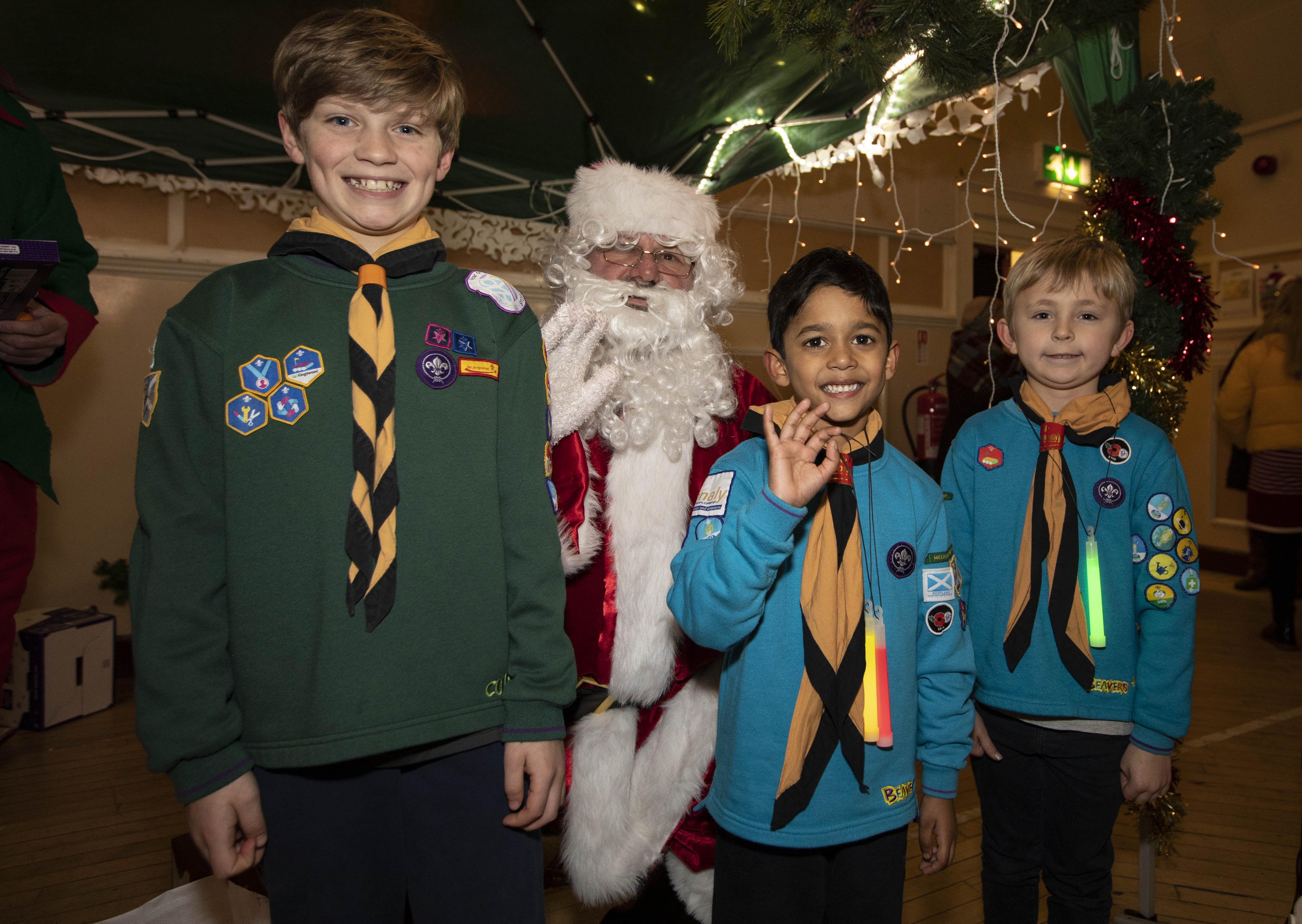 Danny Simons, Reuben Nair and Riley McDevitt from Melrose Scouts with Santa.