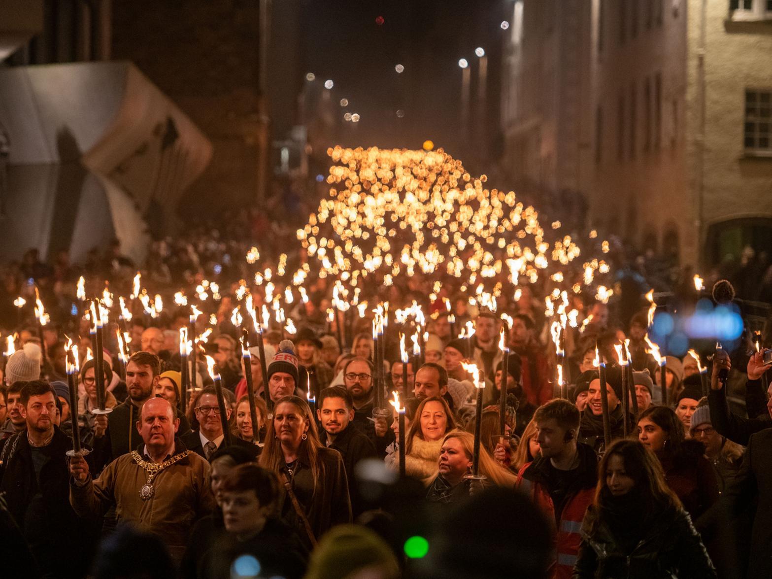 It is thought around 20,000 people took part in the torchlight procession, with another 20,000 estimated to be watching from vantage points in the Old Town . Pic: Ian Georgeson