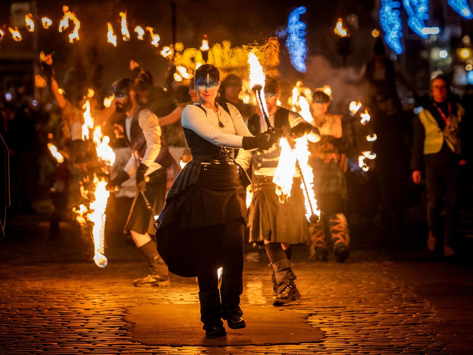 Ten Pipe & Drum bands from across Scotland joined the cast of thousands blazing a river of fire through Edinburghs historic heart for the iconic Torchlight Procession