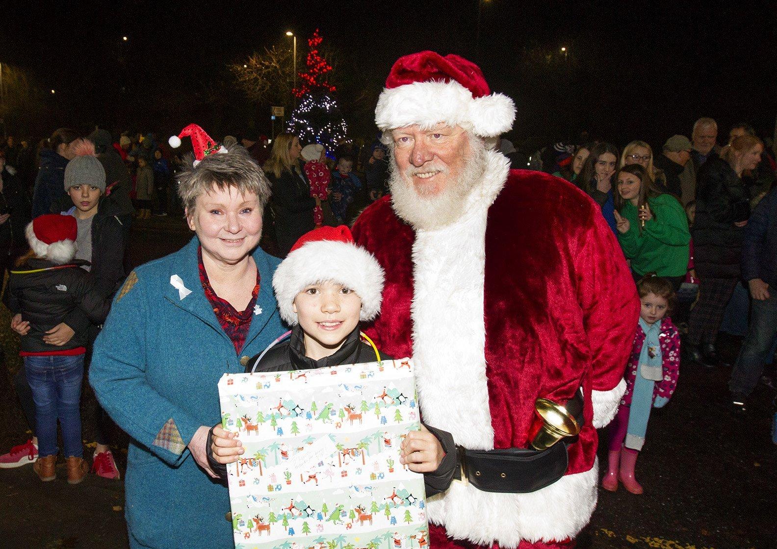 Councillor Elaine Thornton Nicholl with Santa and The VIP on the night turning on the lights, Lewis Turnbull-Moffat