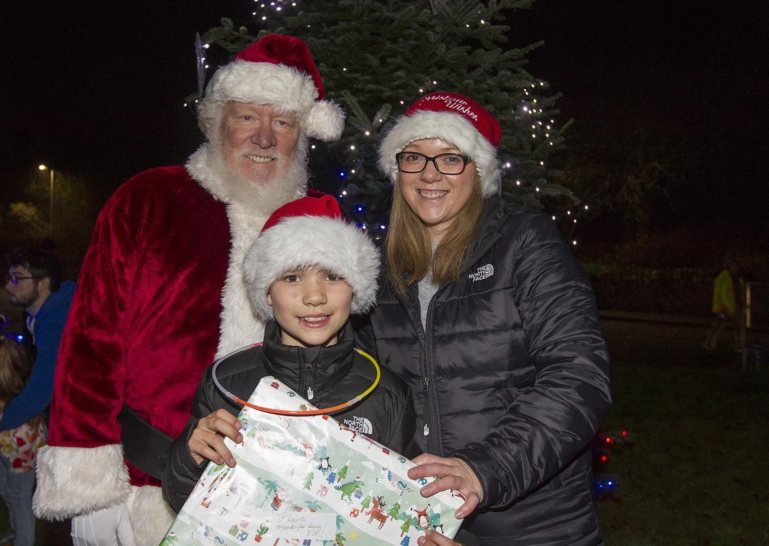 Lewis Turnbull Moffat turned on the lights at Newtown with Santa and his mum Gabrielle