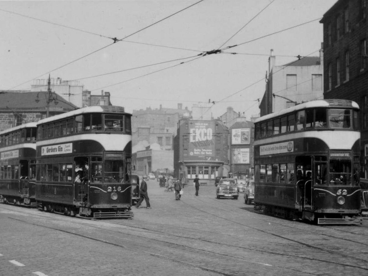 Tram 216 and 52 in Tollcross, the background (which would later become home to  Goldbergs) is completely unrecognisable, having been redeveloped several times since this picture was taken.