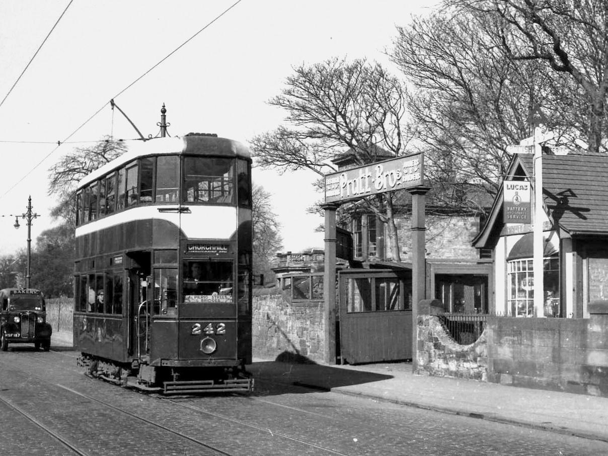 Tram 242 passes the site of the former Caledonian Railway's Ferry Road Station, which was never opened to passengers. The site became Pratt Brothers, an electrical business, and is now flats.