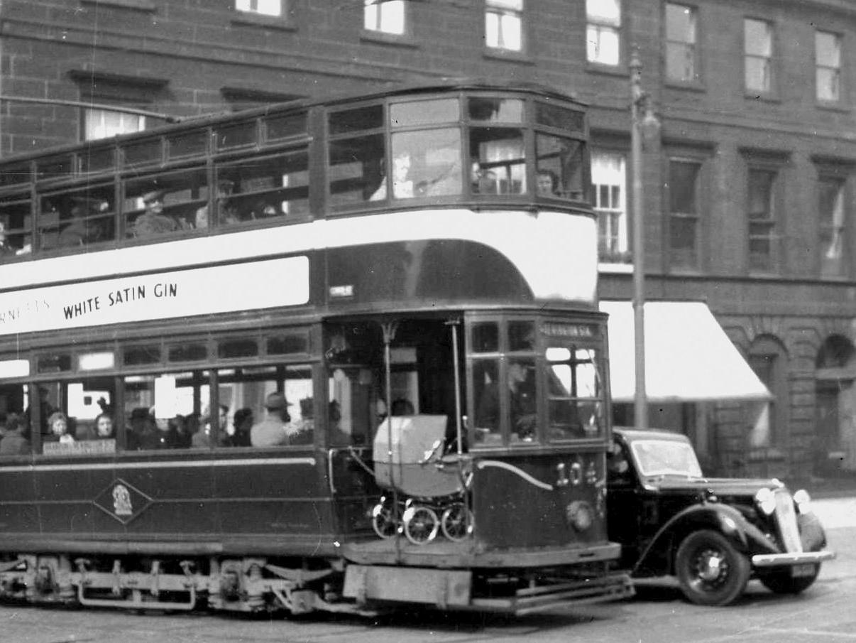 Tram No 104 proving that long before Lothian Buses introduced pram spaces, the trams had it covered... albeit somewhat haphazardly. Hopefully the baby was in its mother's arms at the time.