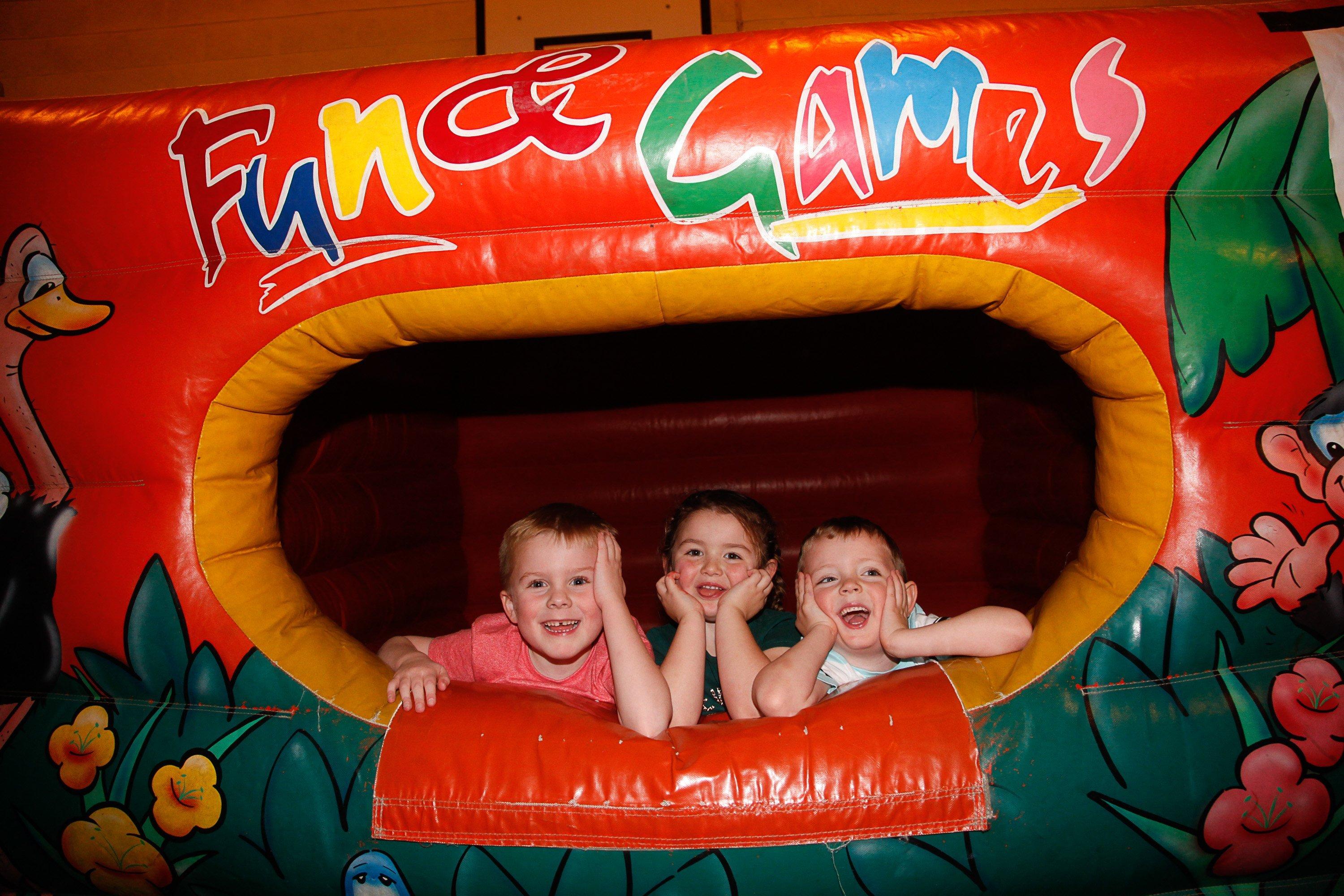 Camelon Winter Festival on Sunday, November 24. Four-year-olds Jacob, Isla and Parker enjoy the inflatables. Picture by Scott Louden.