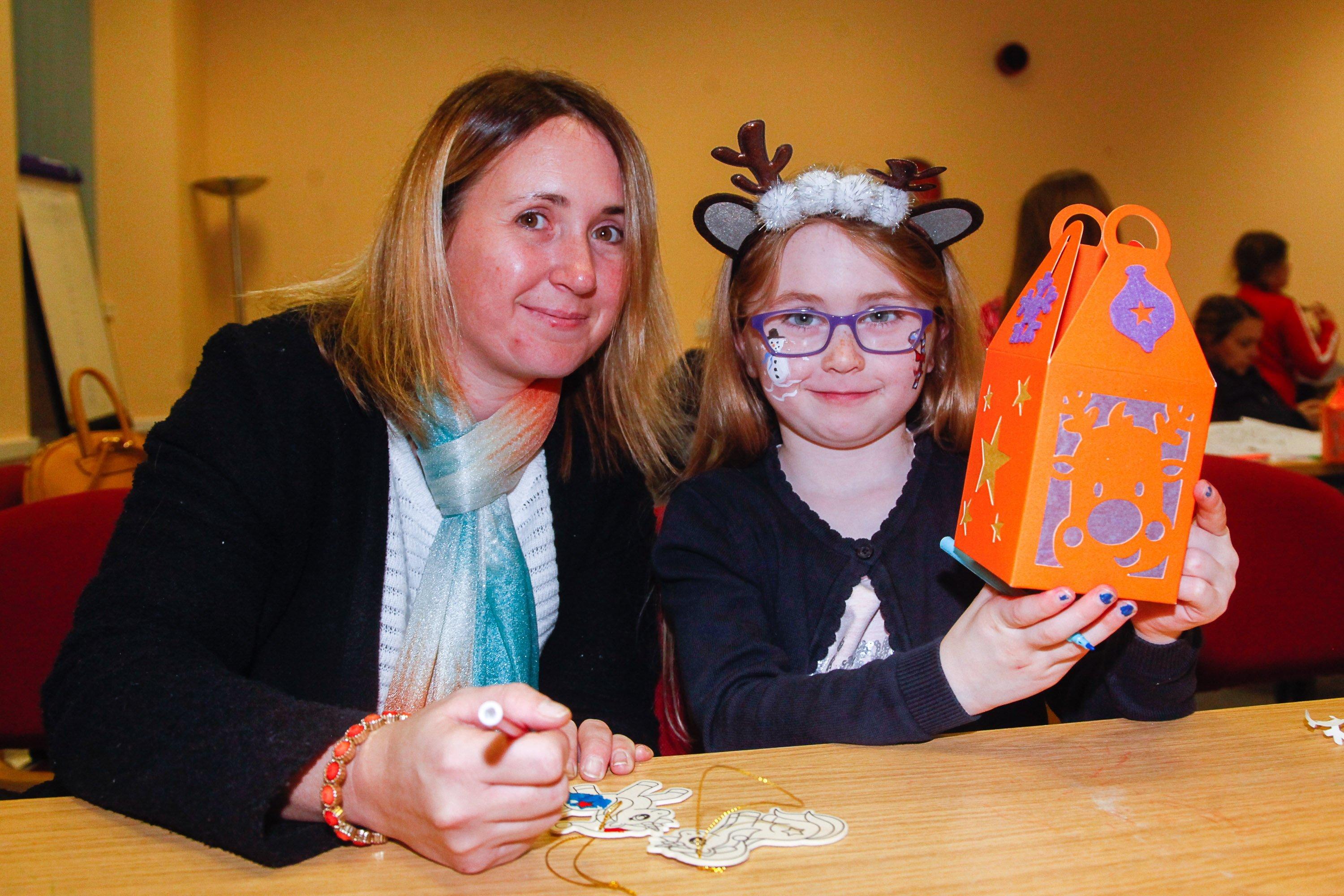Camelon Winter Festival on Sunday, November 24. Layla (6) and mum Danielle Mundie from Maddison making Christmas tree decorations and a lantern. Picture by Scott Louden.