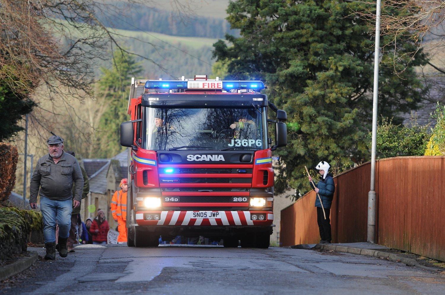 Selkirk's fire engine leads the hunt to the hill.