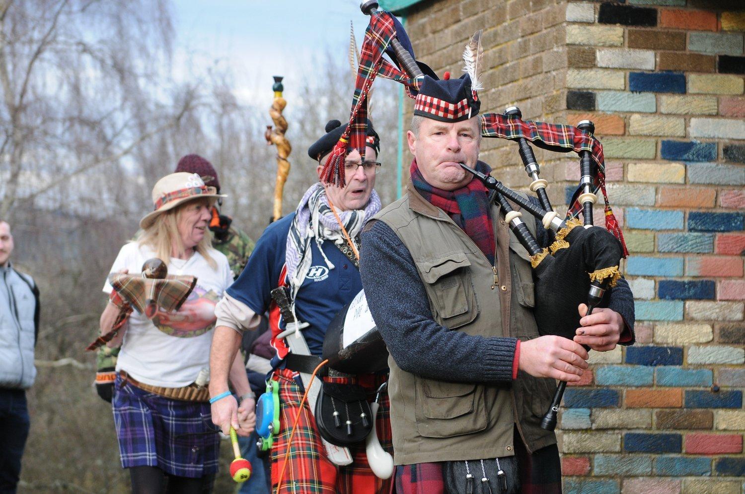 Alan Lindsay leads the haggis round the hut on Selkirk Hill.