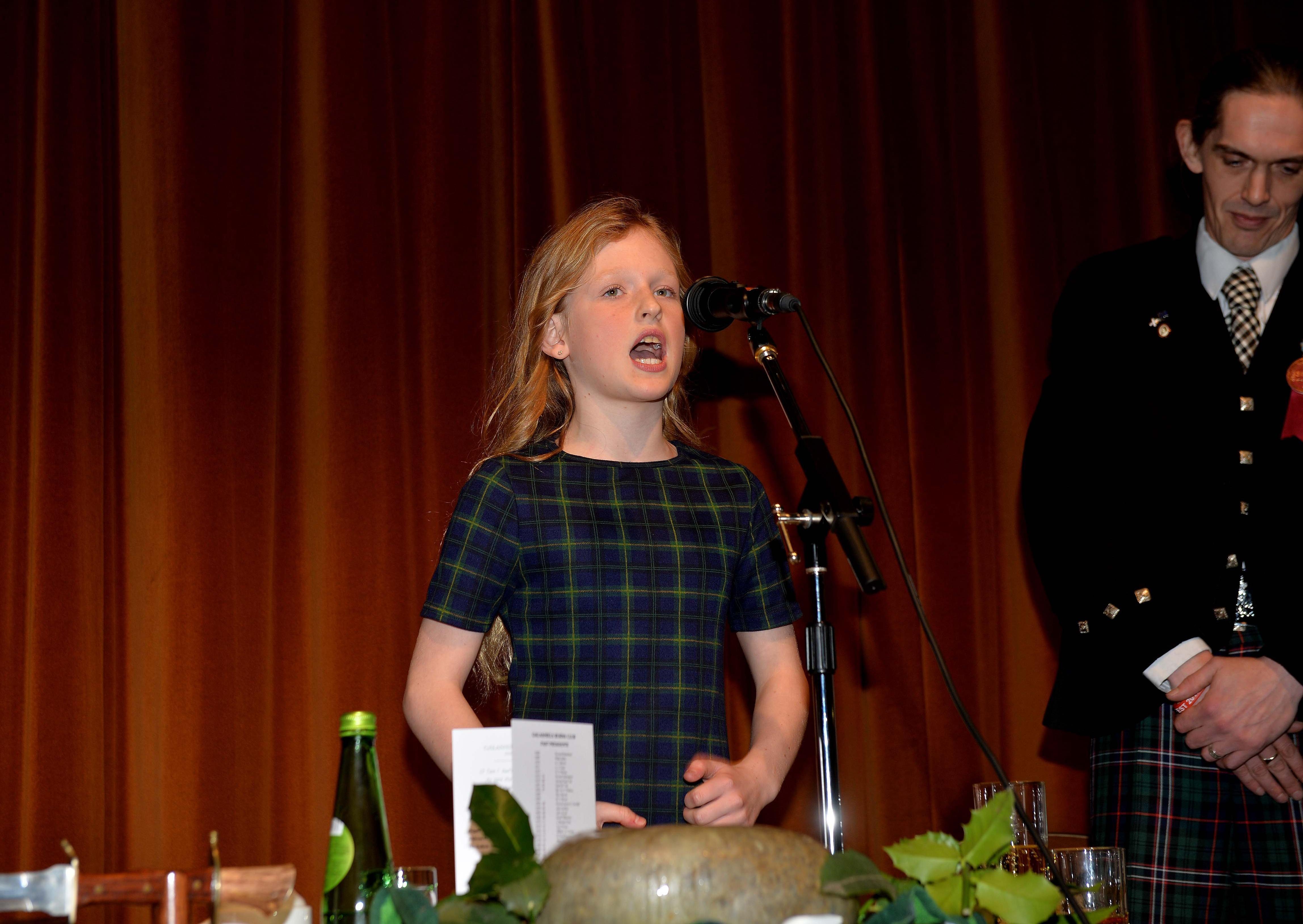 Poppy Lunn addresses the haggis at the Volunteer Hall, watched by Galashiels Burns Club secretary Matthew Burgess.