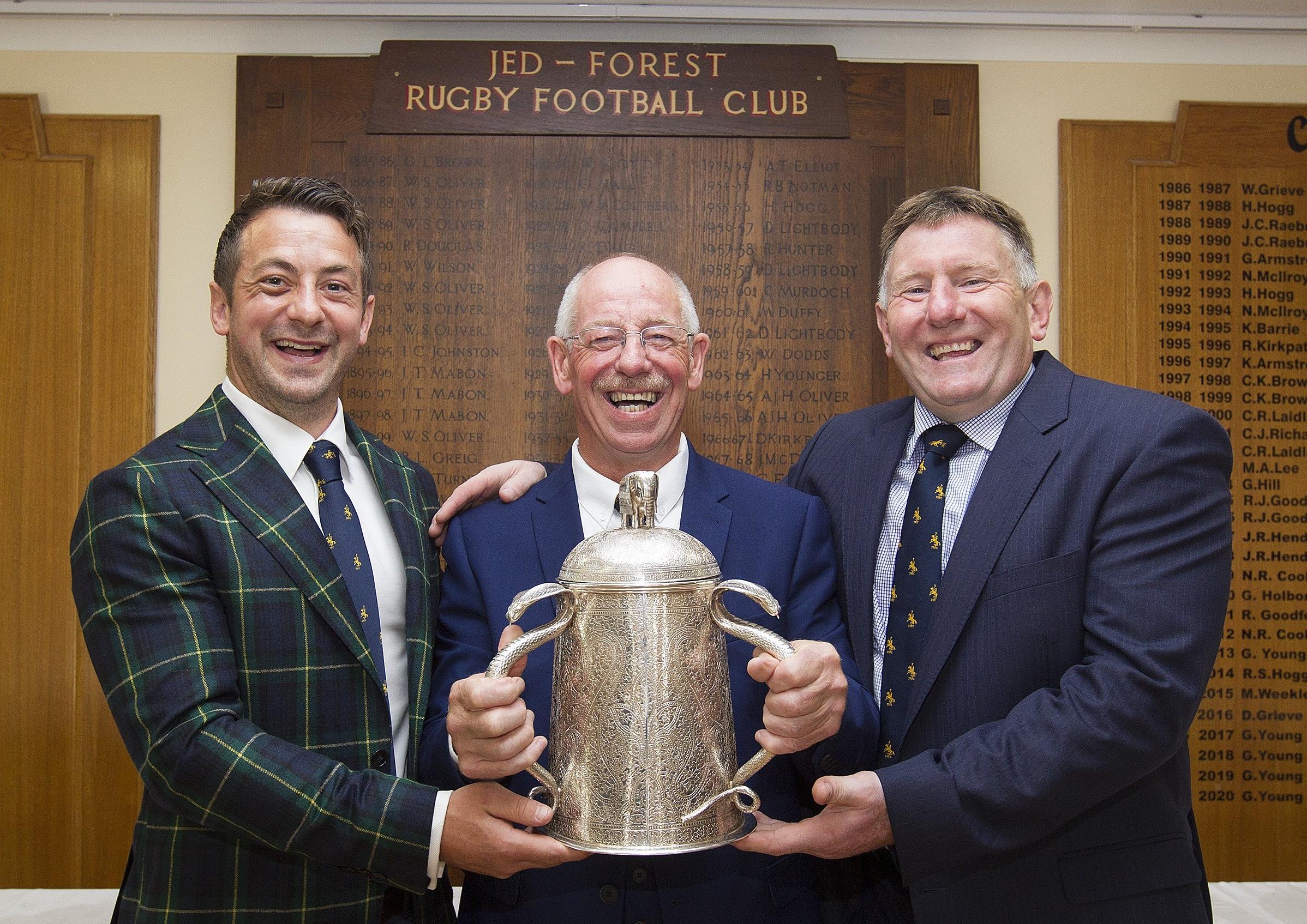 Greig Laidlaw, Roy Laidlaw and Gary Armstrong holding the Calcutta Cup during Jedforest RFC's Three 9s dinner in August 2019.