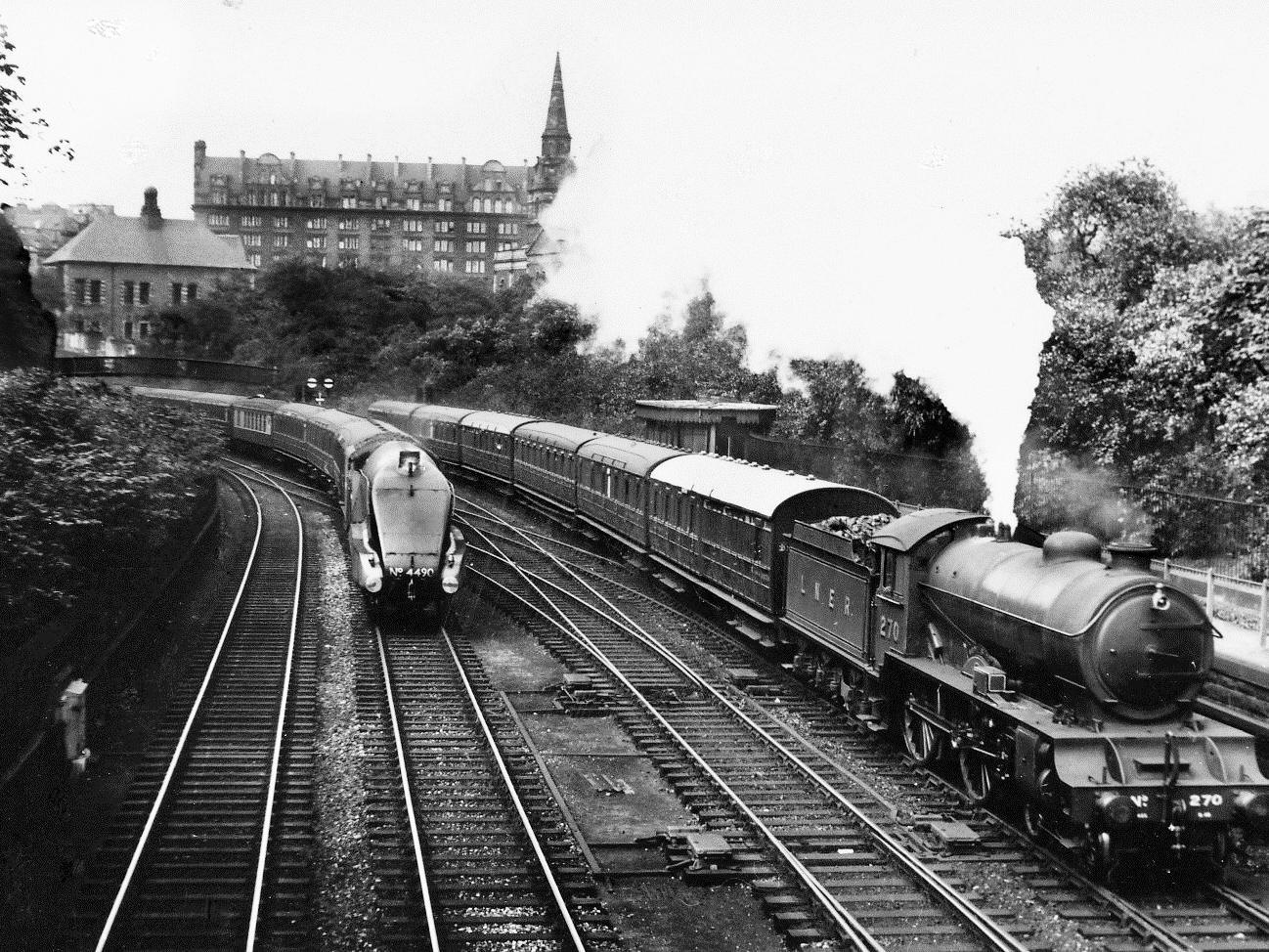 Argyllshire and Empire of India approach Waverley, the Caledonian Hotel can be seen in the background with St Cuthberts church spire in front of it.