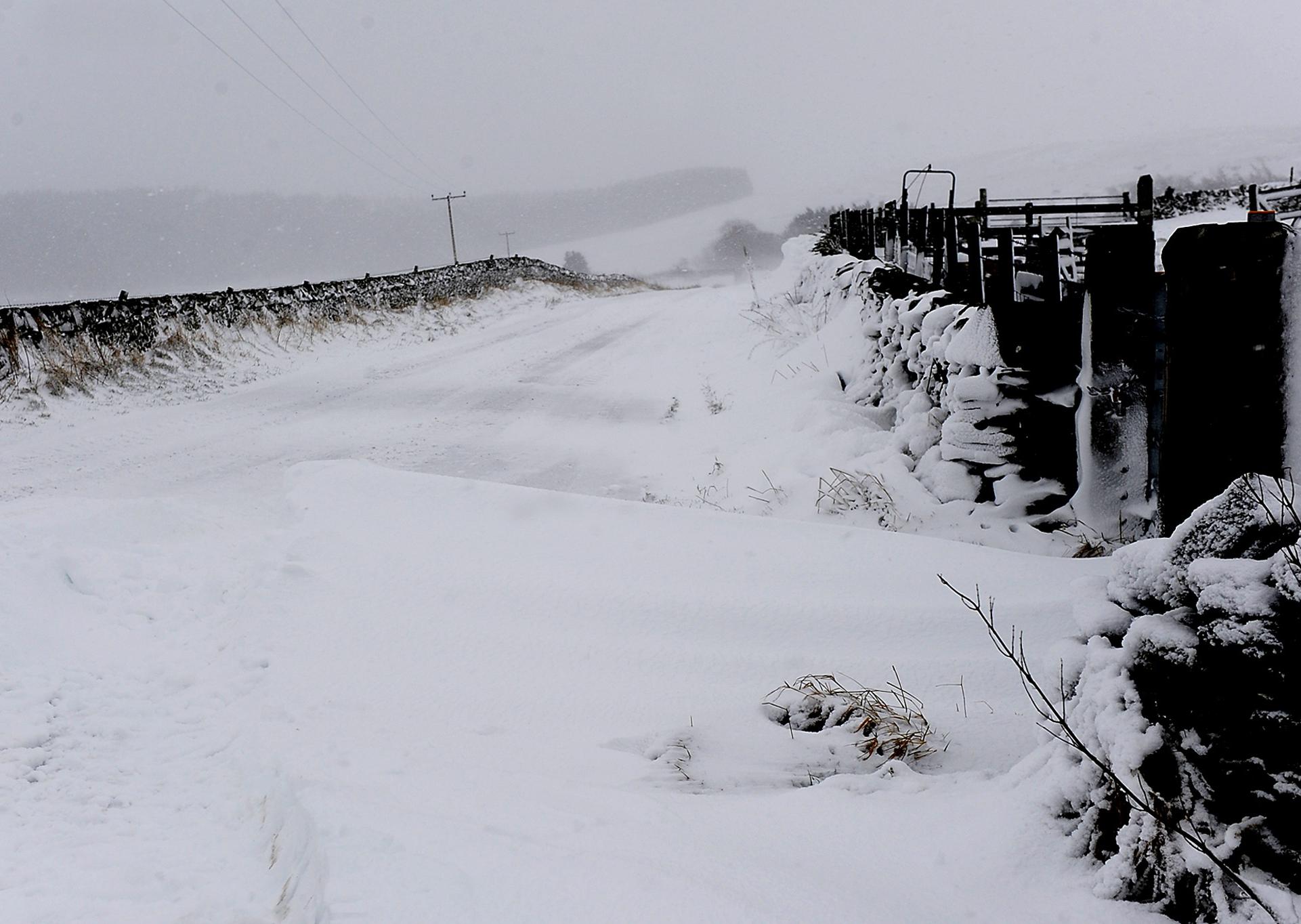 The Ashkirk road from Ettrickbridge  filled in with snow as  blizzards take their toll.