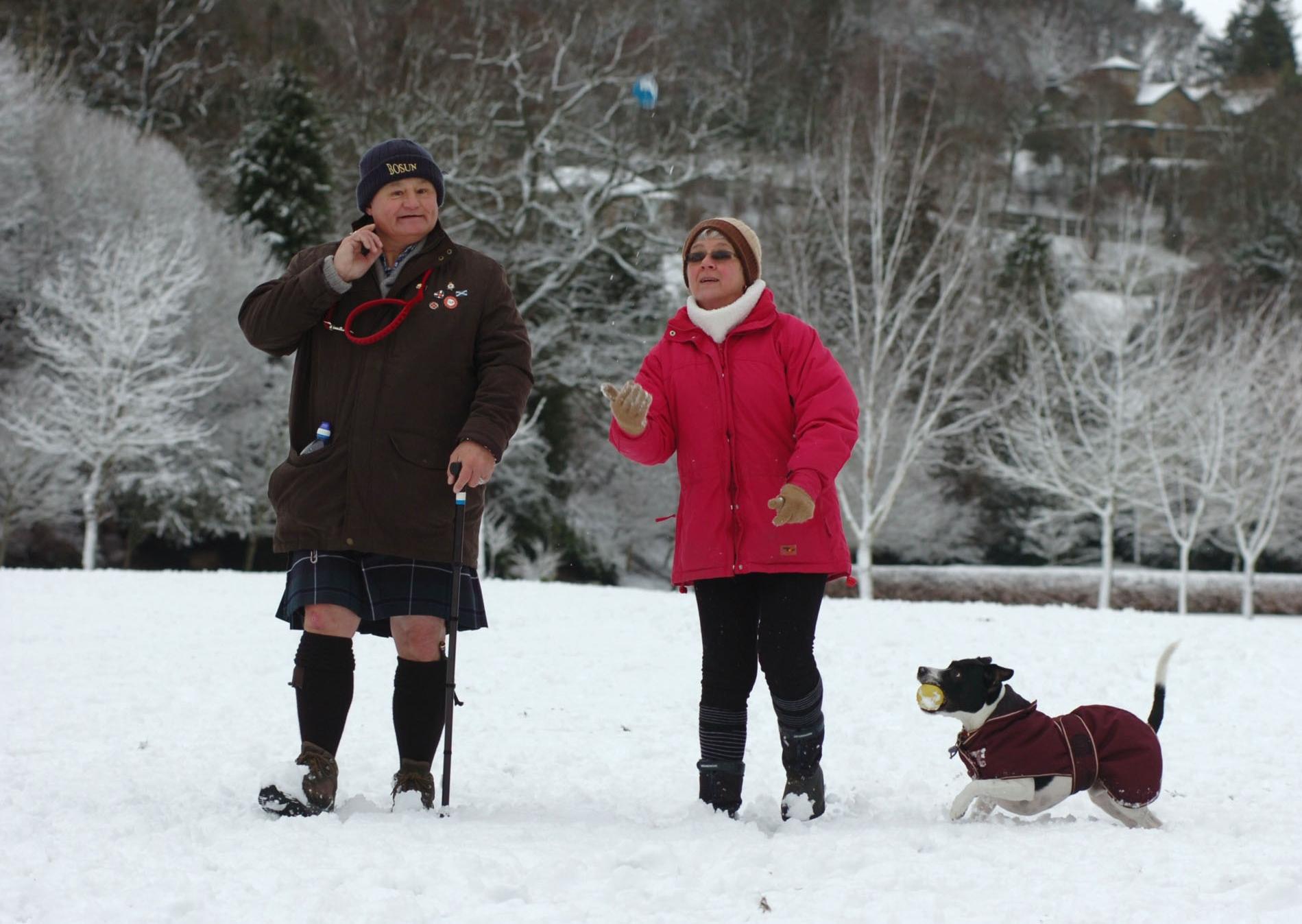 James MacSeoras-Blair with his wife Jaqueline and Dexter the dog take a walk in the snow at Wilton Park, Hawick.