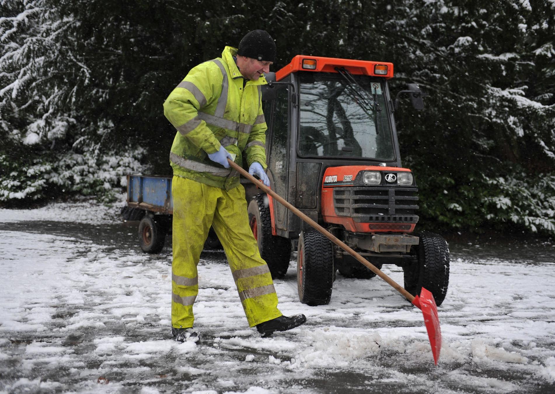 Park worker in Wilton Park Lodge, Hawick clearing the snow.