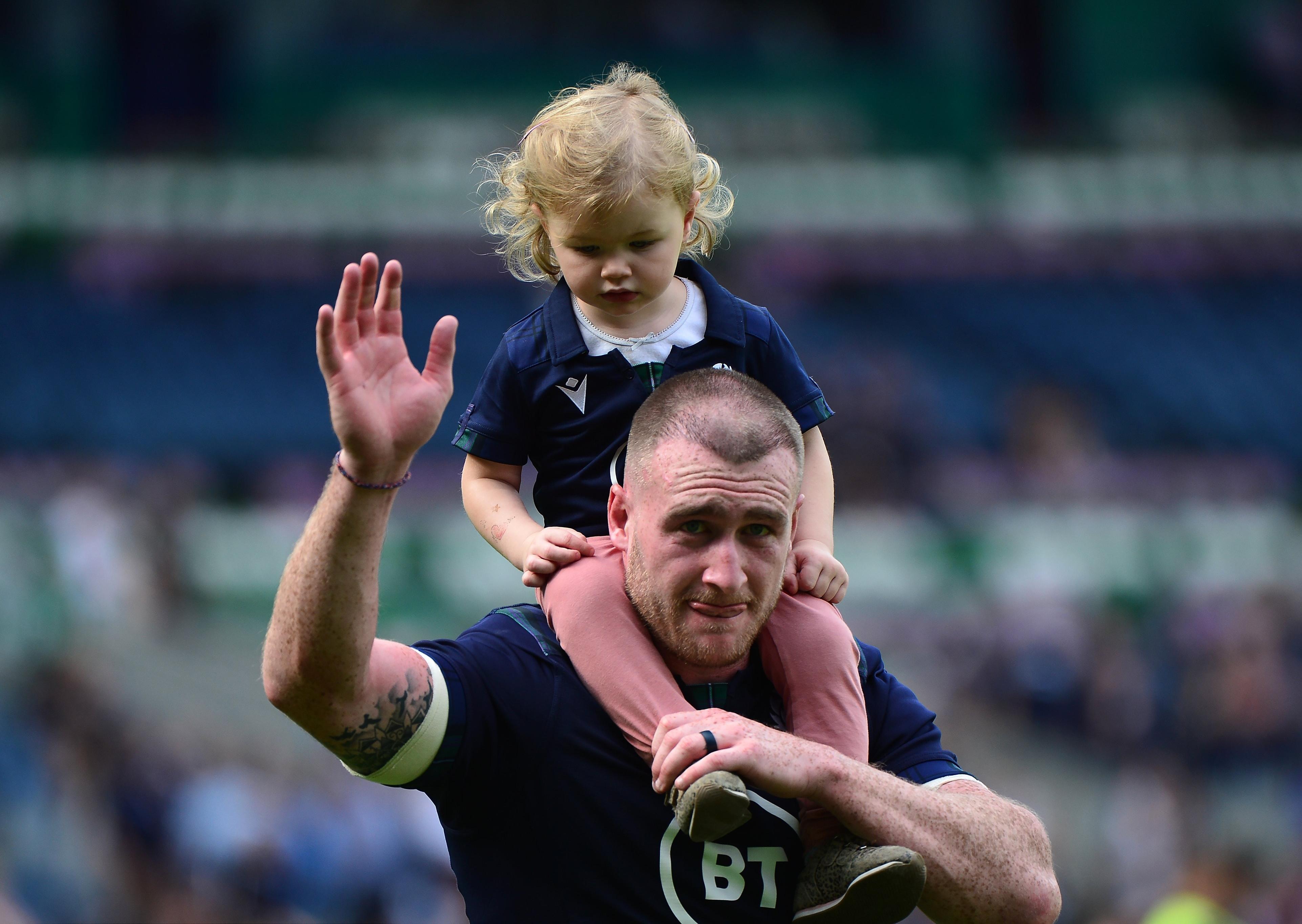 EDINBURGH, SCOTLAND - AUGUST 24: Stuart Hogg of Scotland with his daughter Olivia at the final whistle during the Summer Test match between Scotland and France at Murrayfield Stadium on August 24, 2019 in Edinburgh, Scotland. (Photo by Mark Runnacles/Getty Images)
