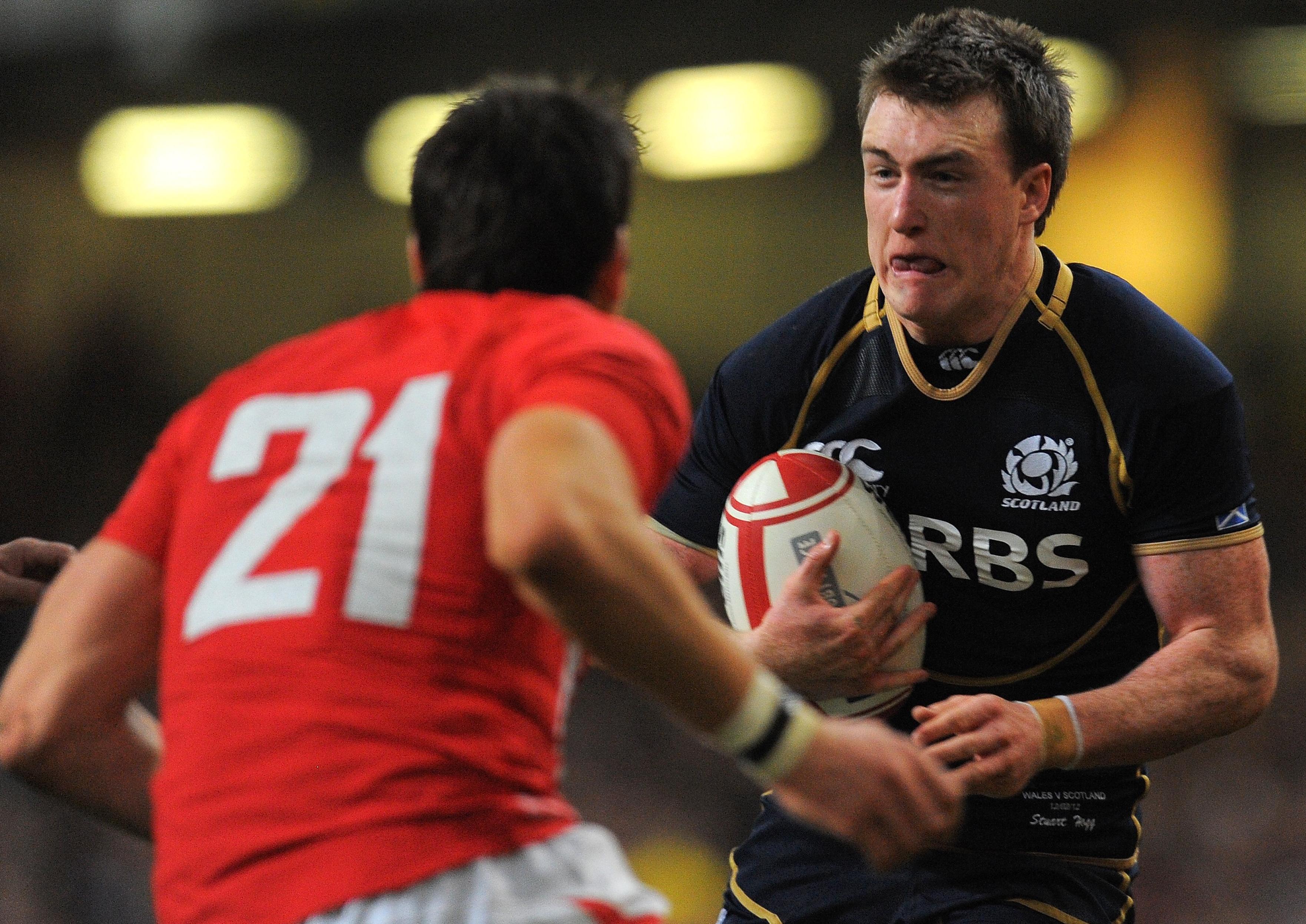 Scotland's Stuart Hogg (R) runs at Wales' James Hook during the Six Nations International rugby union match between Wales and Scotland at the MIllennium stadium in Cardiff, Wales on February 12 2012. AFP PHOTO/ANDREW YATES RESTRICTED TO EDITORIAL USE. (Photo credit should read ANDREW YATES/AFP via Getty Images)