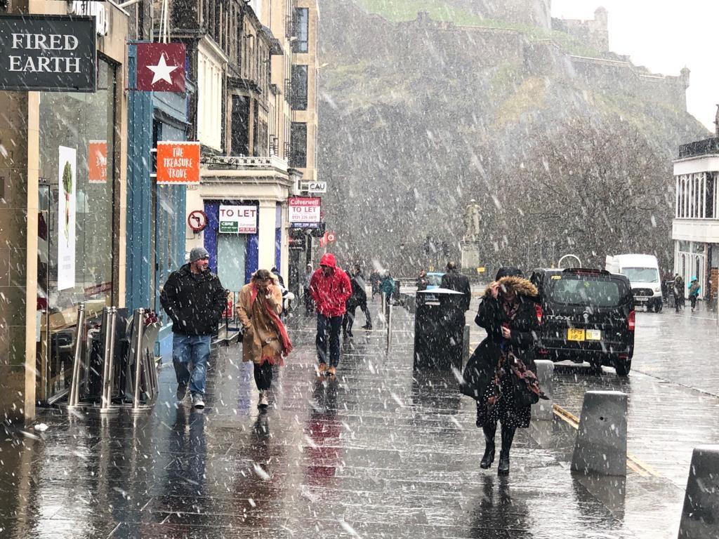 Shoppers in Castle Street, Edinburgh brave the difficult conditions. Pic: Lisa Ferguson
