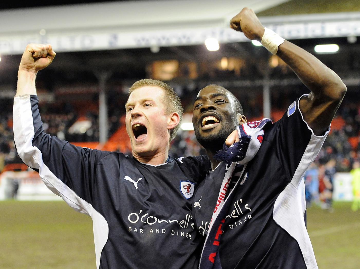 Robert Sloan and Gregory Tade celebrate at full-time.