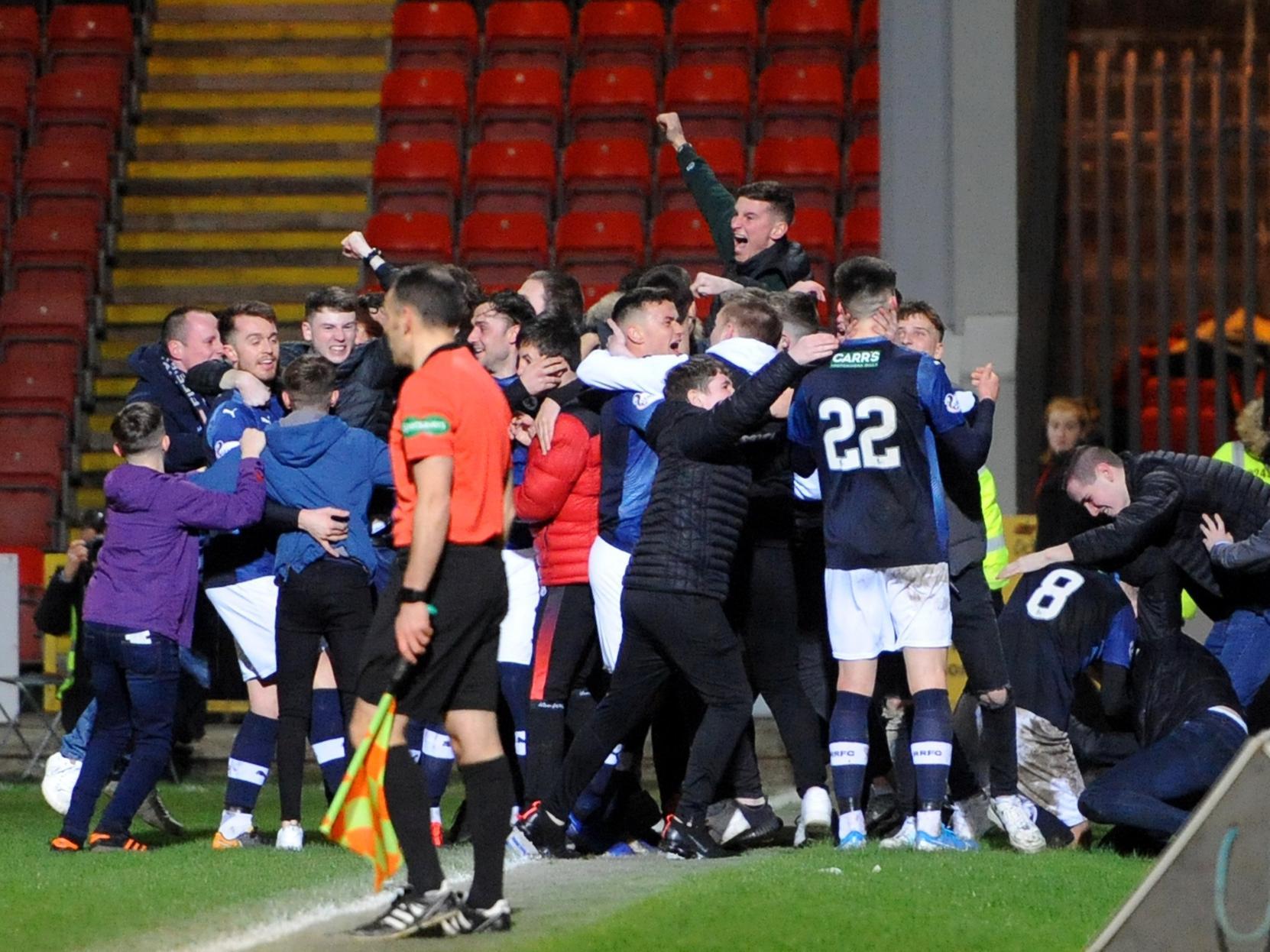 Raith Rovers supporters invade the pitch during the celebrations that followed Regan Hendry's clinching goal.
