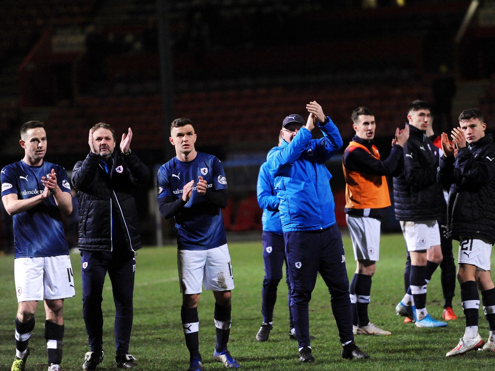 Raith players applaud the travelling fans at full-time.
