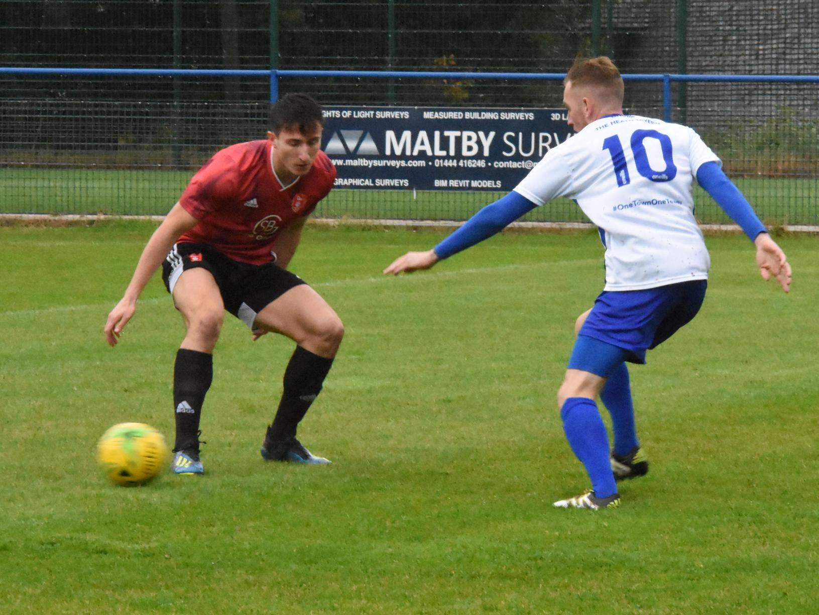Ryan Warwick knocks the ball past a defender.