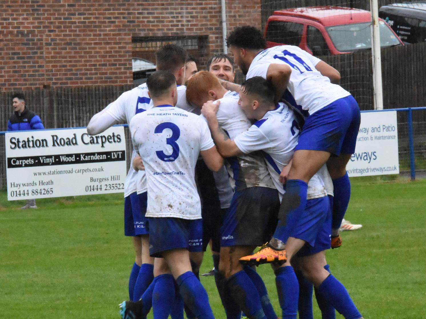 The team celebrates the opening goal.