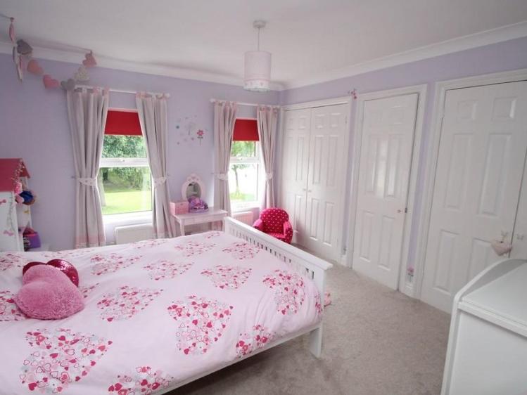 This bedroom is pretty and pink