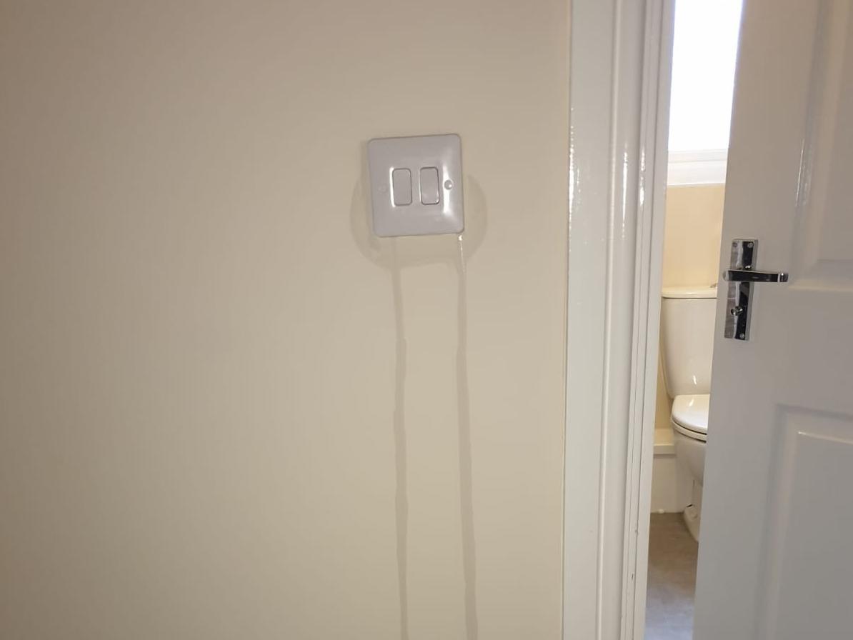Marc and Stacie Smith's home in Kestrel Road has water trickling from a switch down a wall.