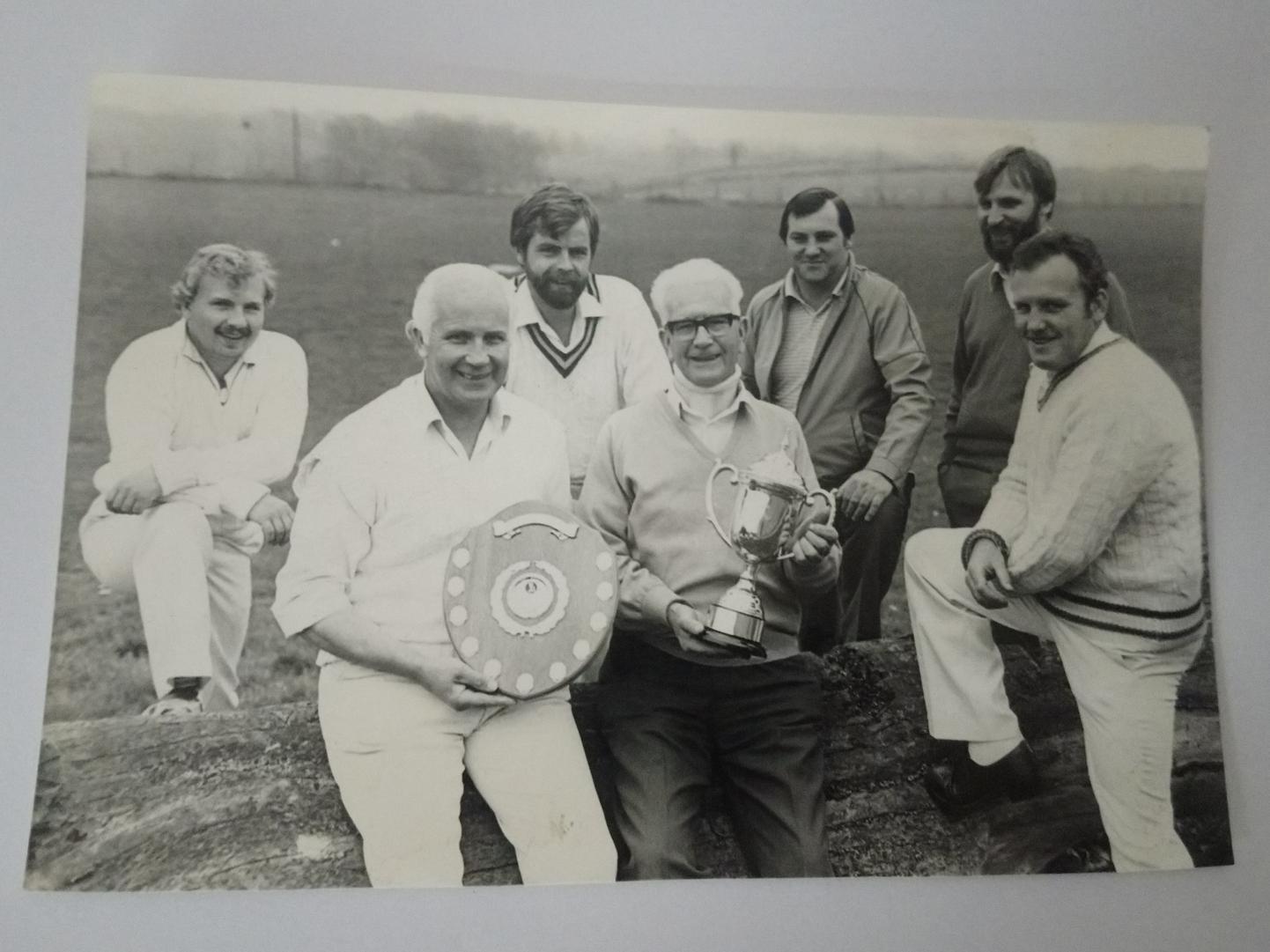 "No one told me my foot would be in the picture." Classic cricket whites and works shoes combination from the trophy-winning Bishops Itchington in 1984.