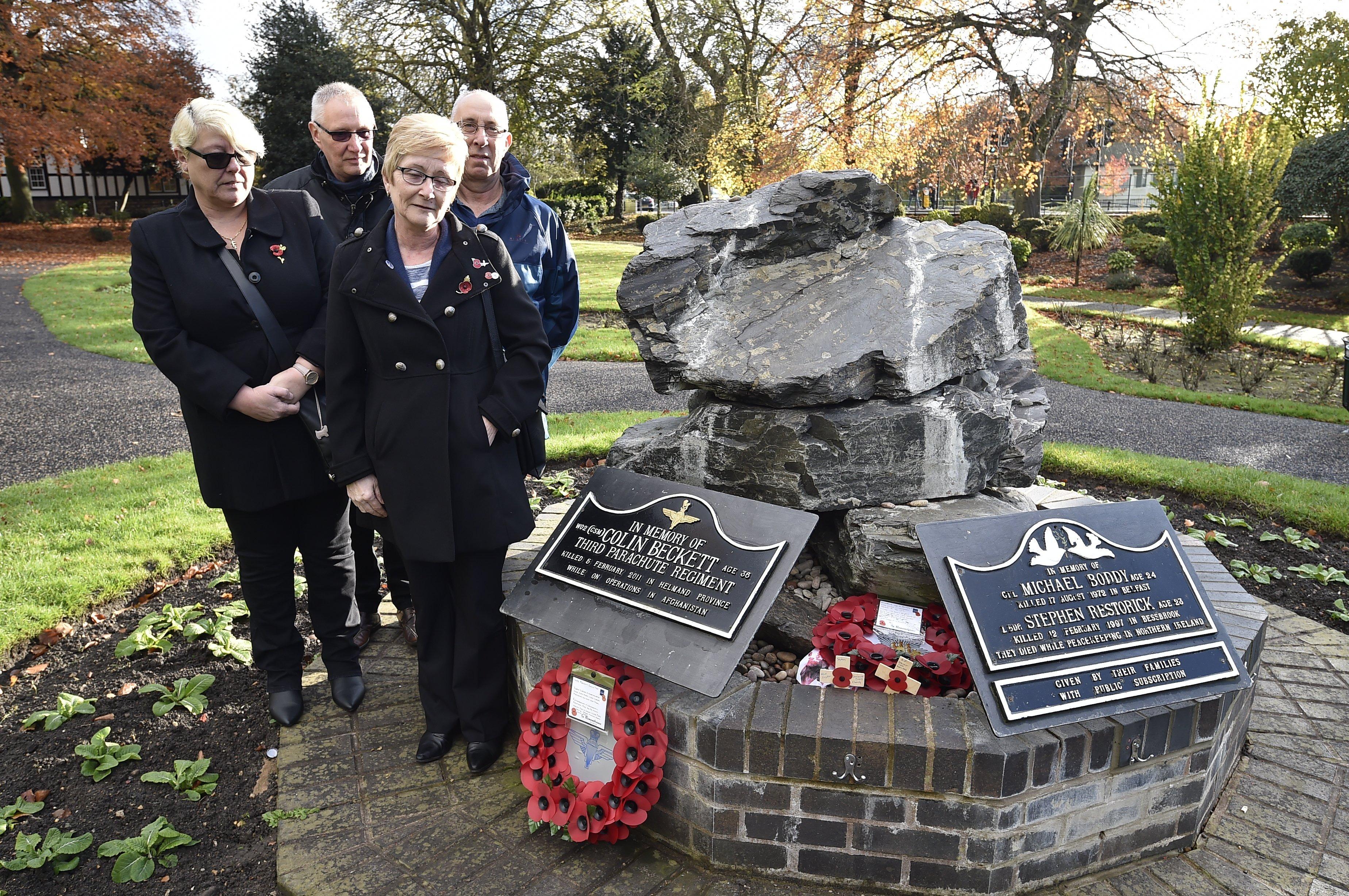 Remembrance Sunday in Peterborough City Centre.  The family of WO2 Colin Beckett lay a wreath at his memorial in Bishop's Gardens. EMN-191011-212541009