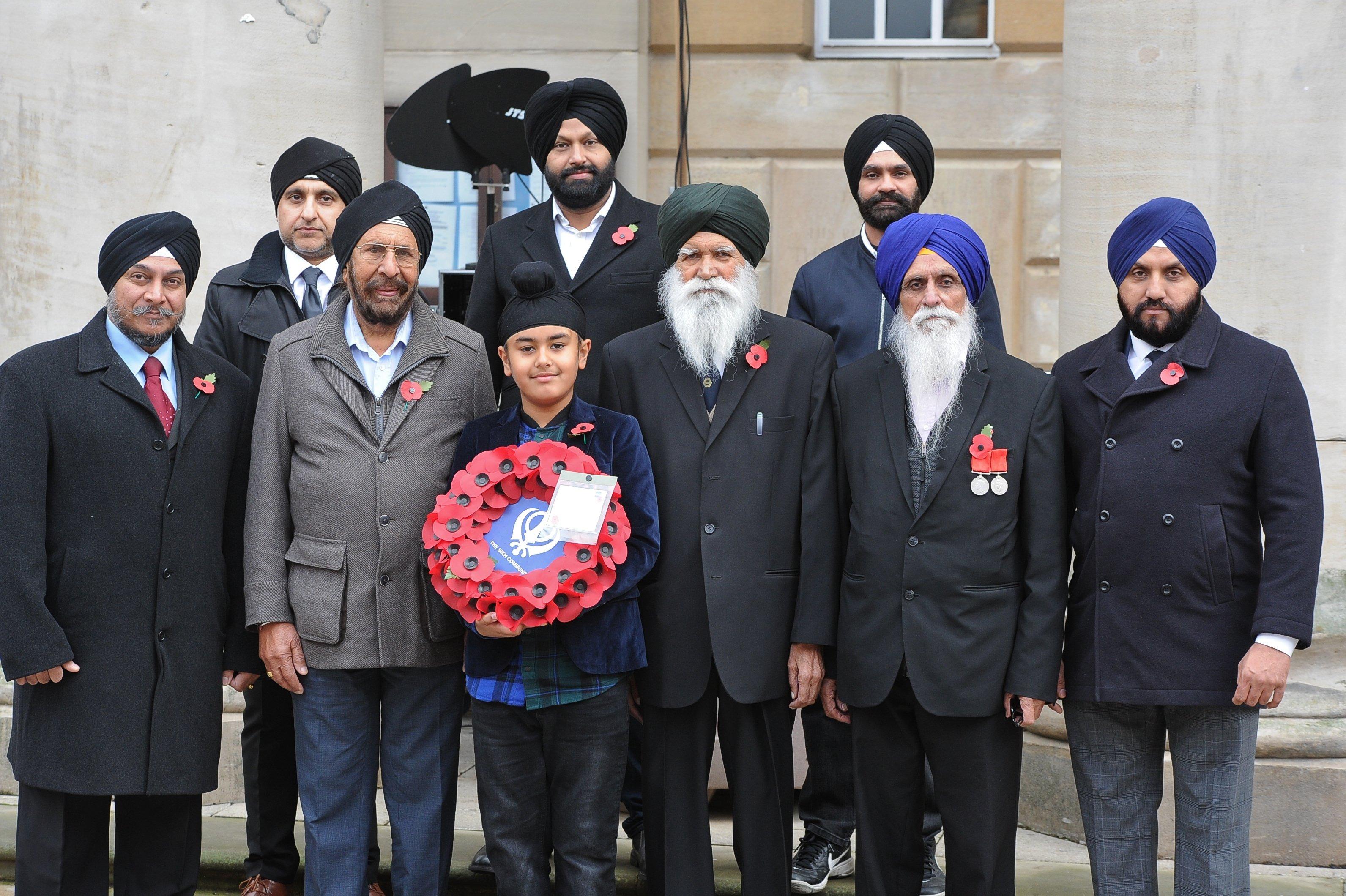 Remembrance Sunday in Peterborough City Centre. Sikhs who laid a wreath at the memorial. EMN-191011-212211009